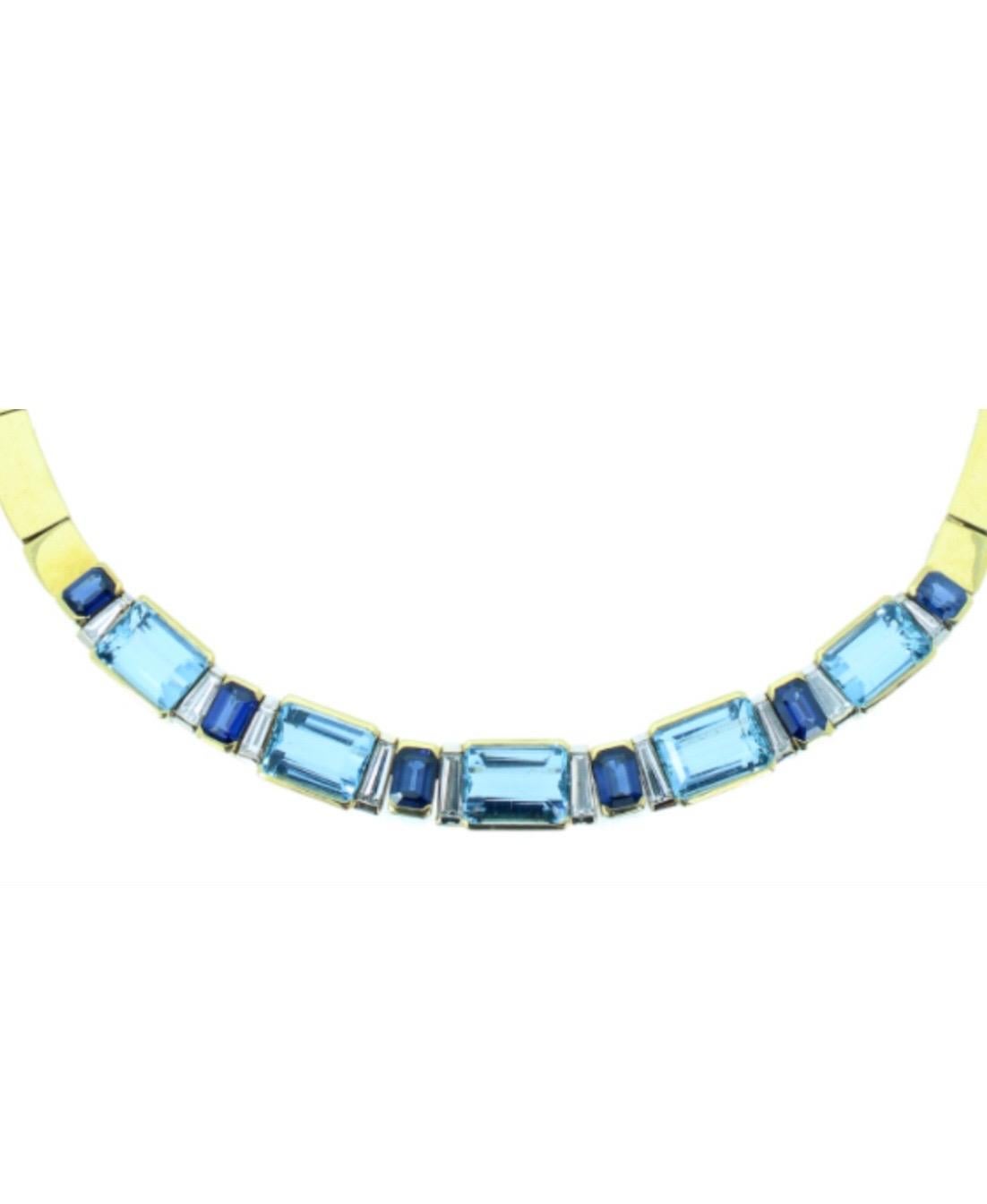 Unique Aquamarine, Sapphire and Diamond Necklace Circa 1970 In 18 Karat Yellow Gold, set with five emerald cut aquamarines totalling approximately 20.00 carats punctuated by sapphires totalling approximately 8.00 carats and tapering baguette cut