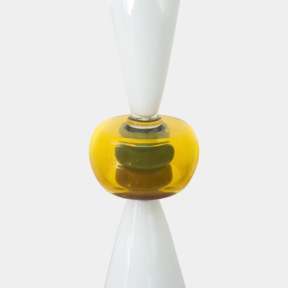 Il vaso di vetro Neobule è stato originariamente progettato da Ettore Sottsass nel 1986. Il vaso è soffiato in vetro e firmato sulla base; per ulteriori informazioni, consulta le informazioni sull'autenticità qui sotto. 

Ettore Sottsass è nato a