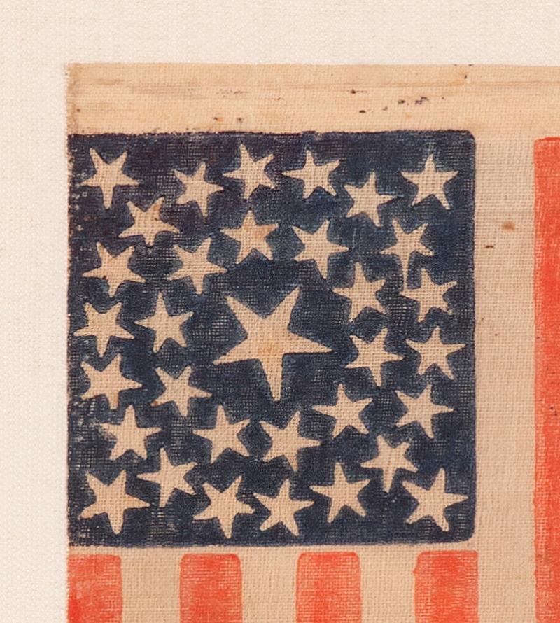 33 STARS IN A DOUBLE-WREATH CONFIGURATION, ON AN ANTIQUE AMERICAN FLAG DATING IMMEDIATELY PRE-CIVIL WAR THROUGH THE WAR'S OPENING YEAR, REFLECTS THE ADDITION OF OREGON TO THE UNION, 1859-1861

33 star American national parade flag, printed on