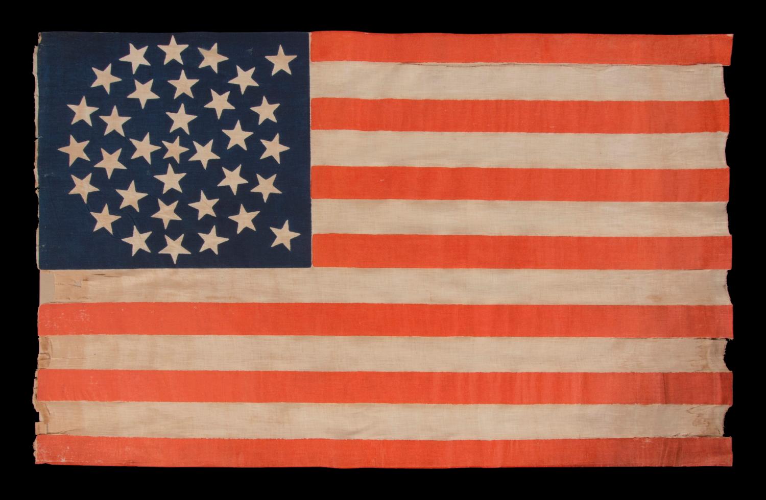 33 STARS IN A MEDALLION CONFIGURATION ON A LARGE SCALE PARADE FLAG, AN EXTREMELY RARE EXAMPLE, OREGON STATEHOOD, 1859-1861:

This 33 star American parade flag, printed on coarse, glazed cotton, is an especially large and visually attractive example