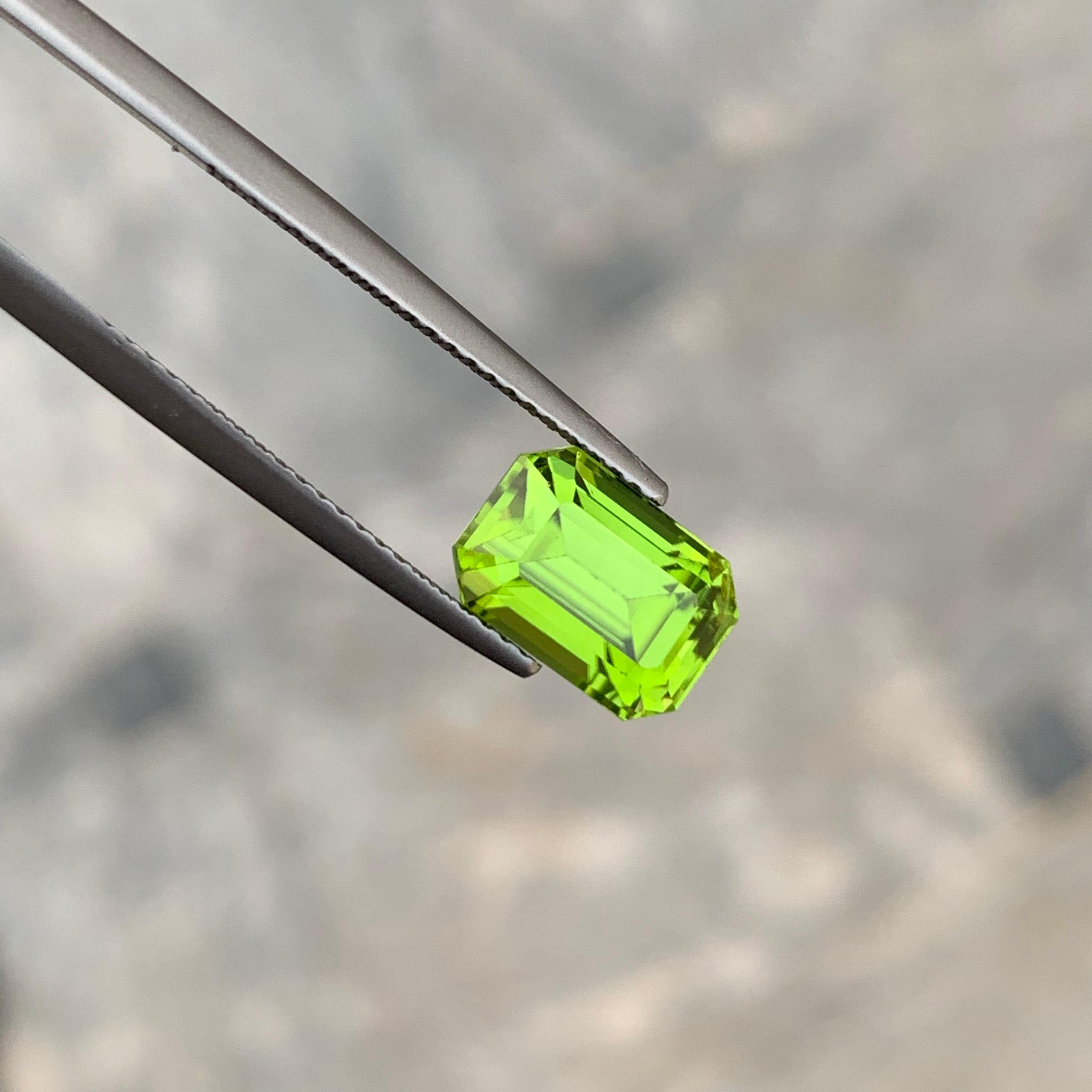Arts and Crafts 3.30 Carat Apple Green Loose Peridot from Pakistan with Emerald Shape For Sale