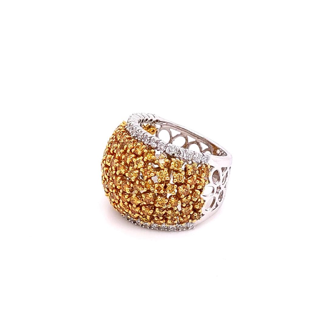 Bold and Brilliant 18k Two-tone White and Yellow Gold Band Glistening with Row after Row of Dazzling Natural Fancy Yellow Diamonds.
Total Carat Weight: 3.30 Carat
Fancy Yellow Diamonds: 2.66 Carats (total 98 stones)
White Diamonds: 0.64  Carats