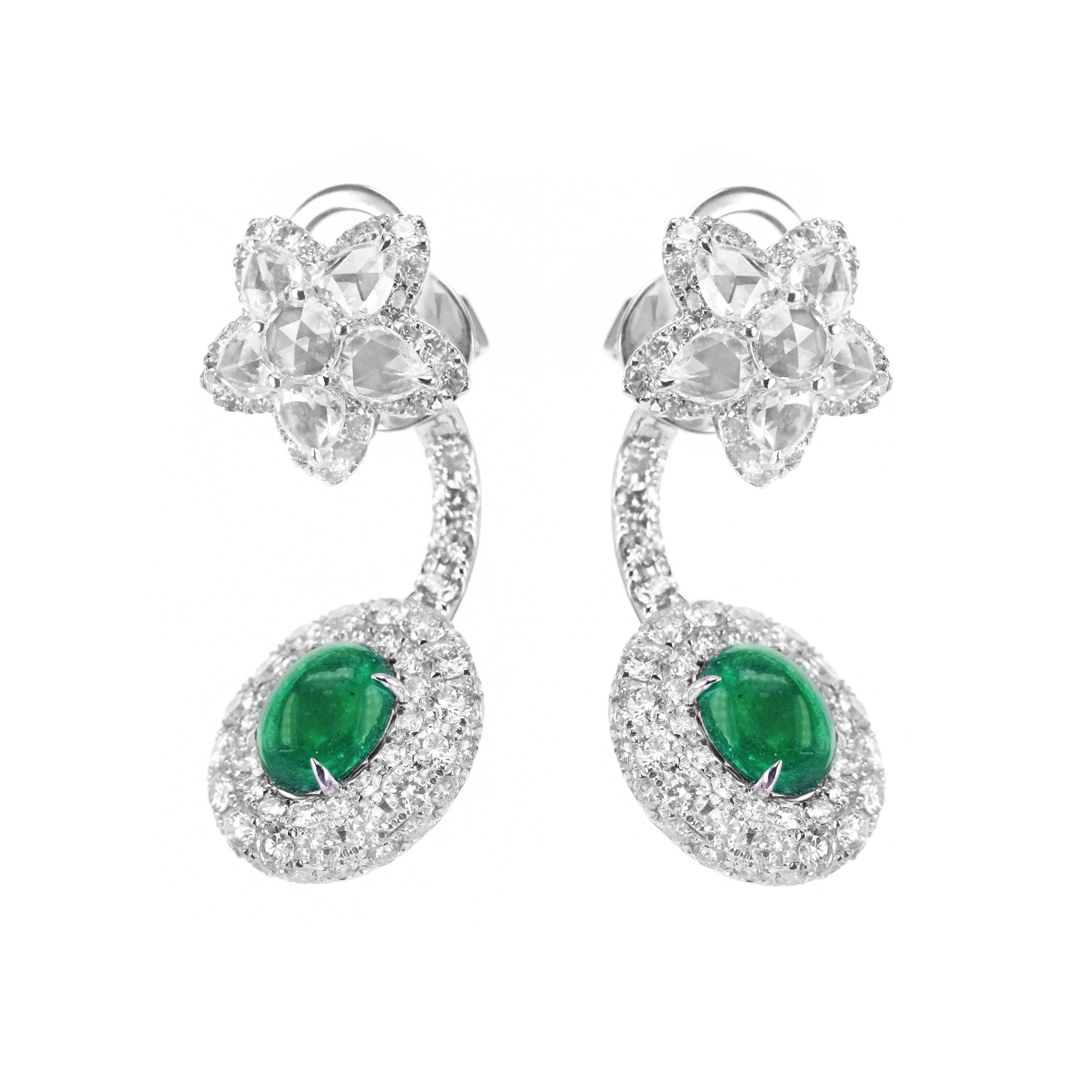A 3.30 carat Colombian Emerald are set along with 5.84 carat of 'D' Color Vvs Clarity white diamond in this behind the ear drop earring. The earring has been made in 18K Gold and has been crafted in Hong Kong by the very talented hand made jewelry