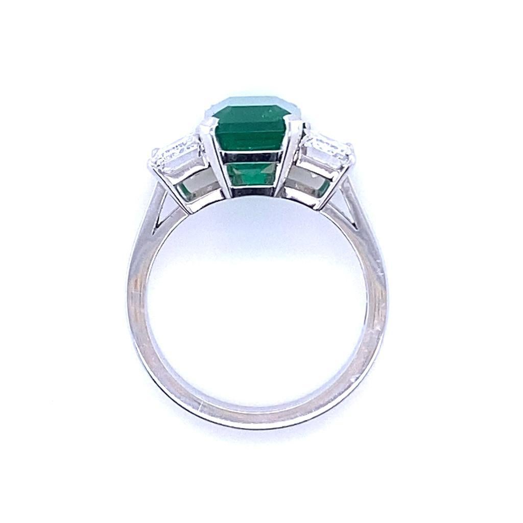 Emerald Cut 3.30 Carat Columbian Emerald and Diamond Three Stone Platinum Engagement Ring