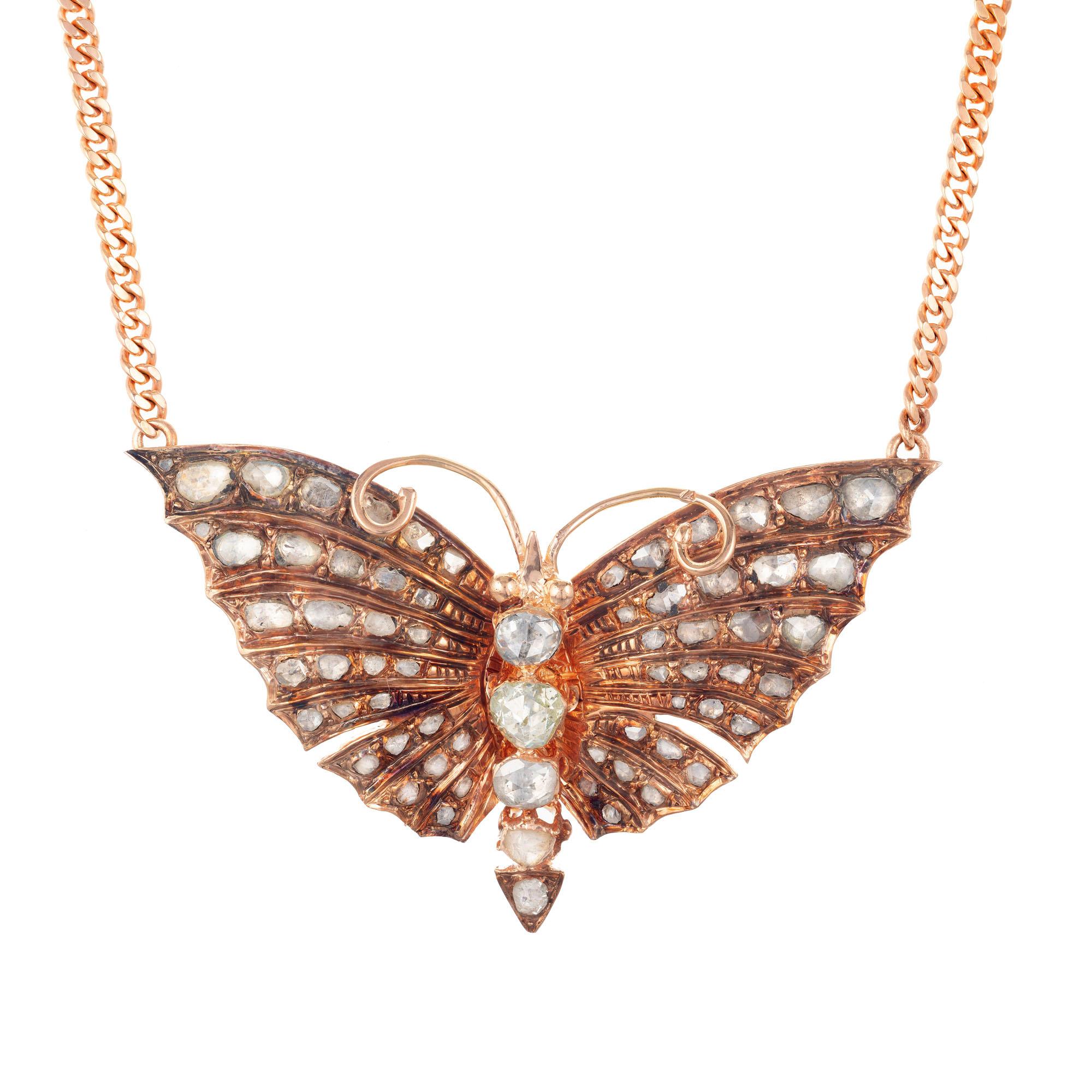 Estate early Victorian 1850s butterfly diamond pendant necklace. 14k rose gold with rose cut diamonds on a rose gold chain. Natural patina. Chain is later, approximately 1900.

69 old rose cut I-L SI-I diamonds, Approximate 3.30cts 
14k rose gold
