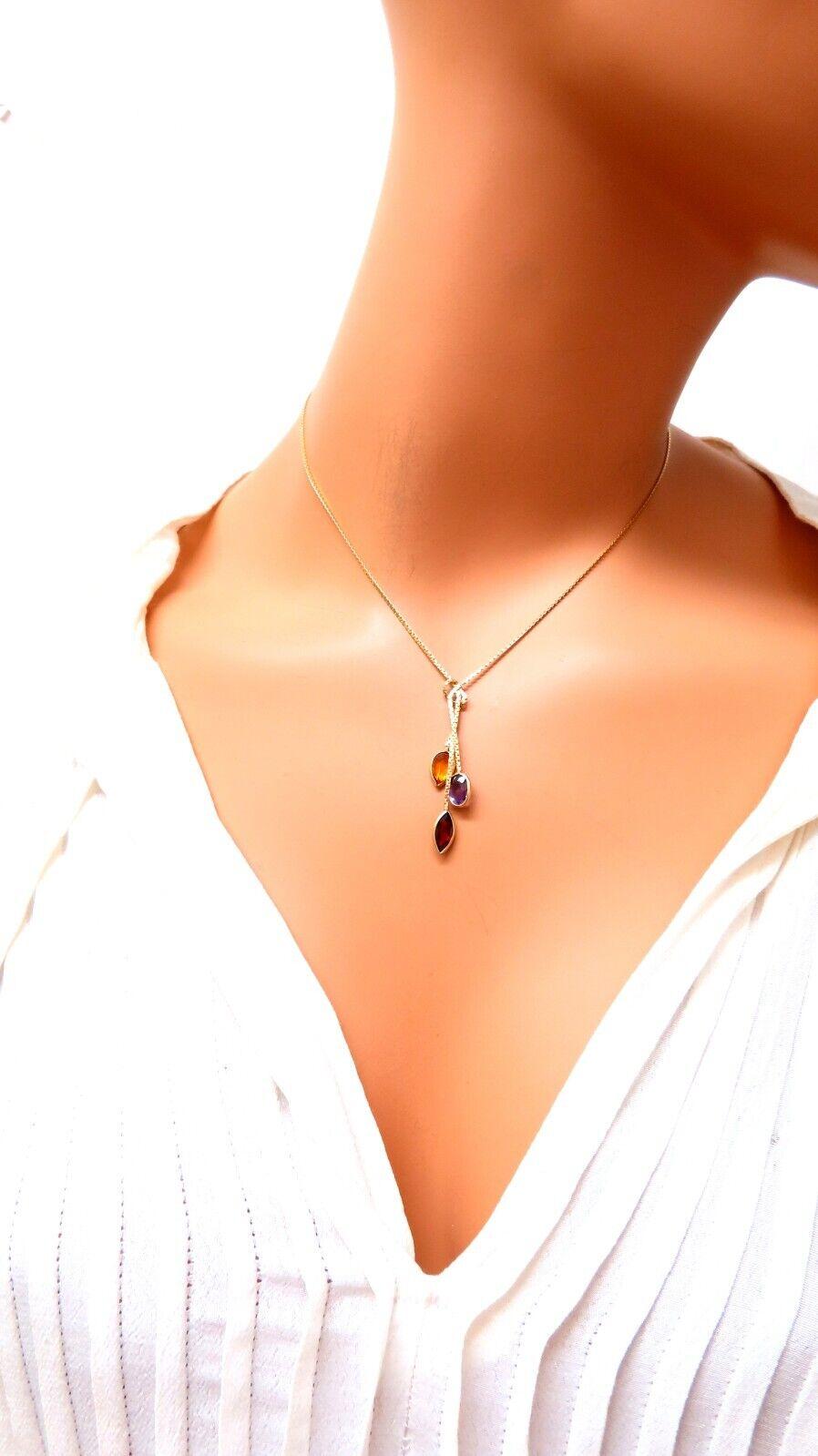 3.30 carat natural total weight of amethyst garnet and citrine.

Oval cut, Marquee and pear cuts.

16 in long, 14 karat gold

3 grams