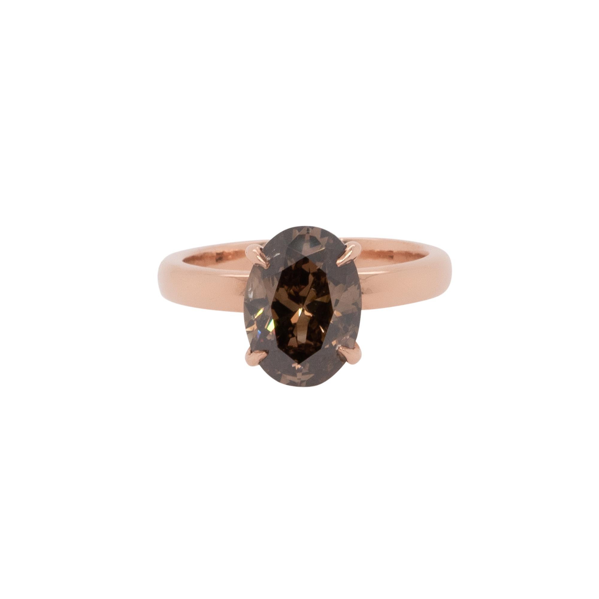Center Details: 3.30ct Natural Oval Cut Diamond that is Fancy Brown in color and I1 in clarity.

AJI Report # 219-136216L

Ring Material: 14k Rose gold

Ring Details: Rose gold solitaire smooth mounting

Ring Measurements: 20mm x 11mm x 28mm

Ring