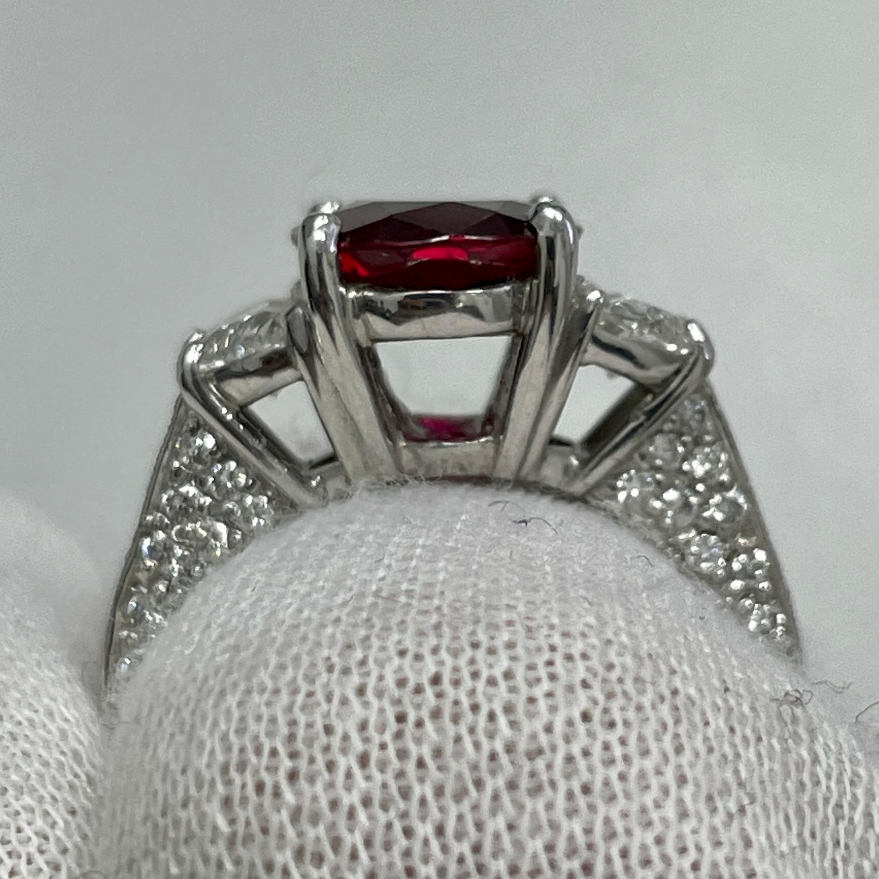 This is an incredibly spready ruby mounted in a platinum ring with brilliant white half-moon diamonds and signed by JB Star. Suitable for any occasion!