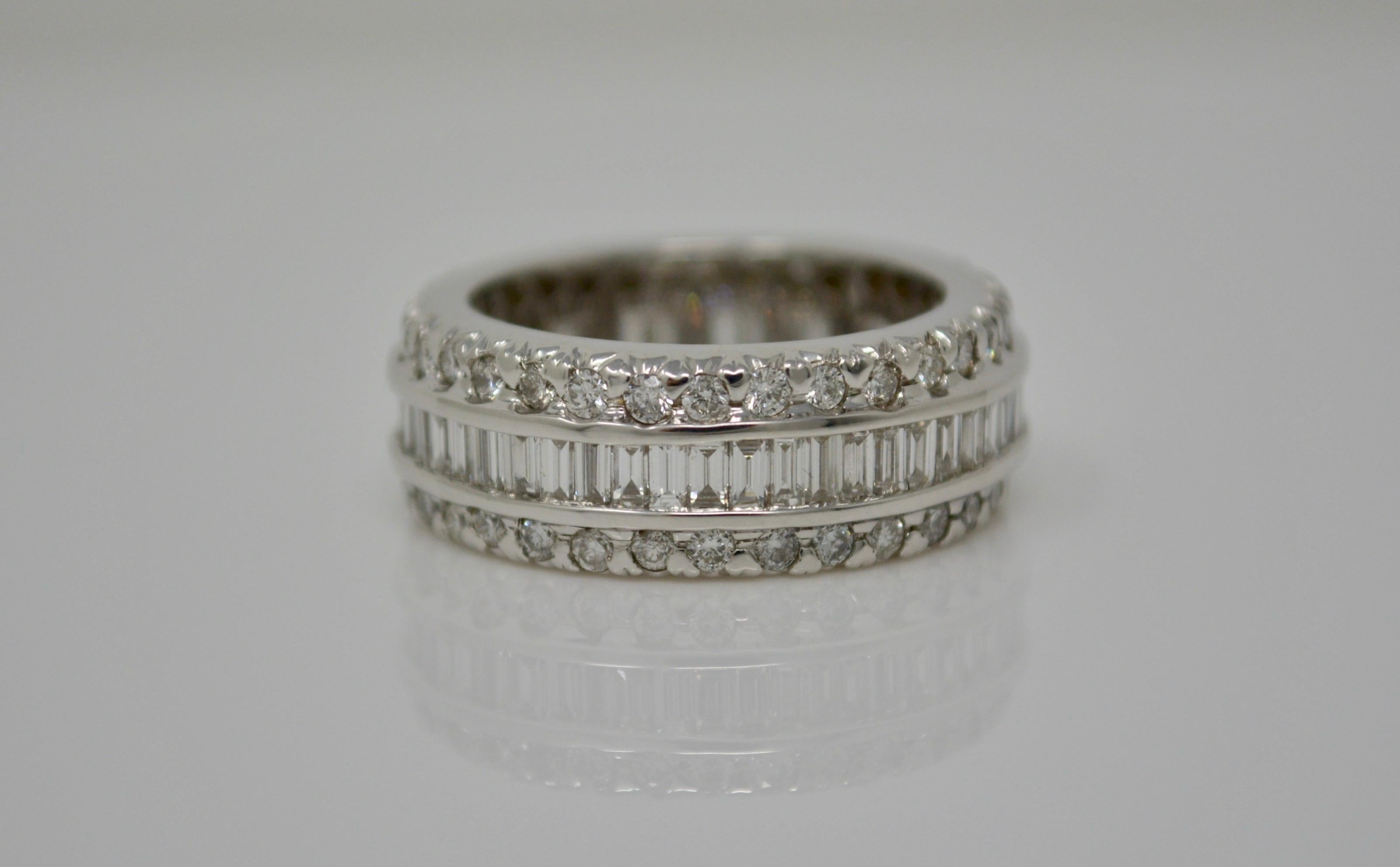 Exquisite wedding Eternity band hand crafted in 18k white gold features a total of 3.30 carat white round brilliant and baguettes with G-H color and VS clarity. The ring size is 7. 