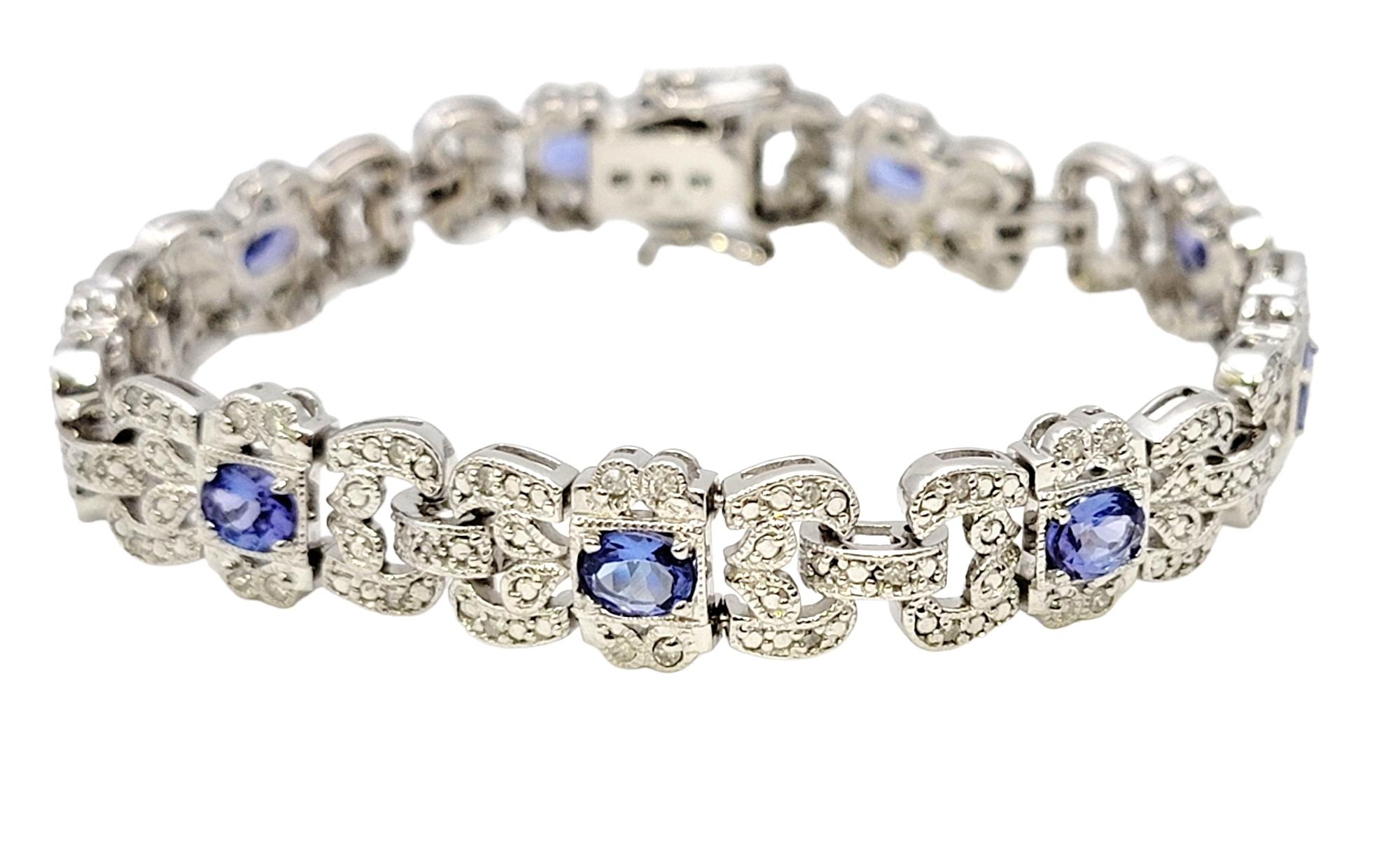 Length: 7.00 Inches

This mesmerizing tanzanite and diamond bracelet is truly an exquisite piece of jewelry that perfectly captures elegance and sophistication.

Crafted from lustrous 14 karat white gold, this bracelet features a series of