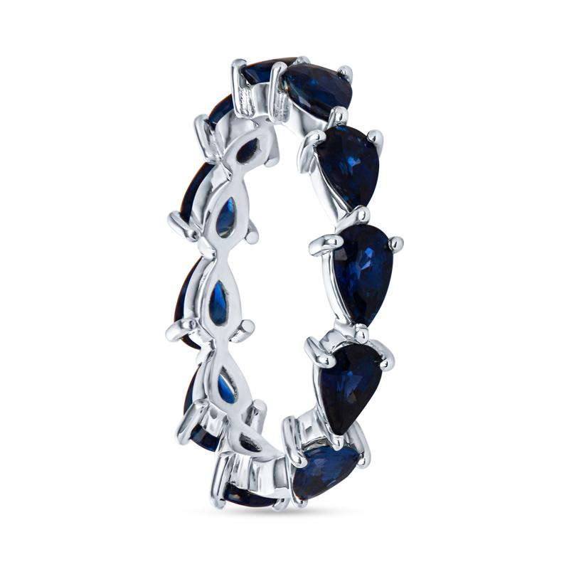This chasing pear band features 3.30 carat total weight in natural blue sapphires set east west. It is set in 18 karat white gold with a small sizing space. Wear alone, with your engagement ring, or stack with your other favorite bands! This band is