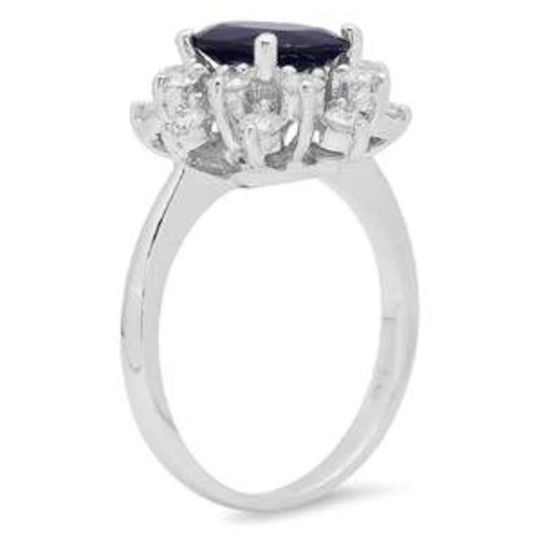 3.30 Carats Exquisite Natural Blue Sapphire and Diamond 14K Solid White Gold Ring

Total Blue Sapphire Weight is: Approx. 2.50 Carats

Sapphire Treatment: Diffusion

Sapphire Measures: 9.00 x 7.00mm

Natural Round Diamonds Weight: Approx. 0.80