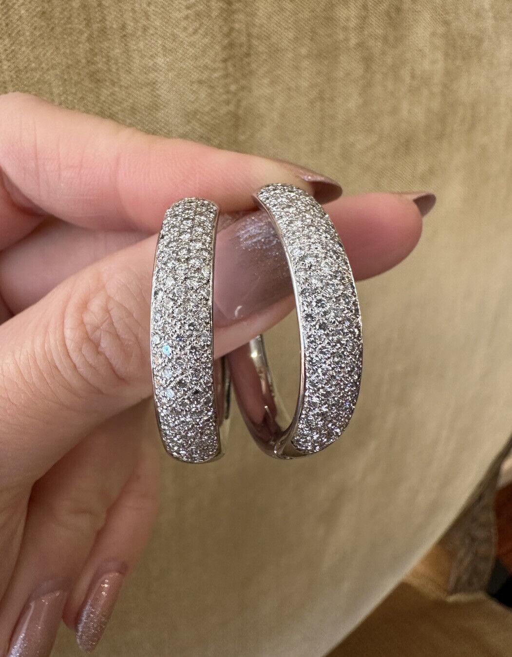 Round Hoop Pavé Diamond Earring in 18k White Gold

Round Hoop Pavé Diamond Earrings feature five rows of Round Full-cut Diamonds pavé set on the outside half, set in high-polished 18k White Gold

Total diamond weight is 3.30 carats.
The earrings