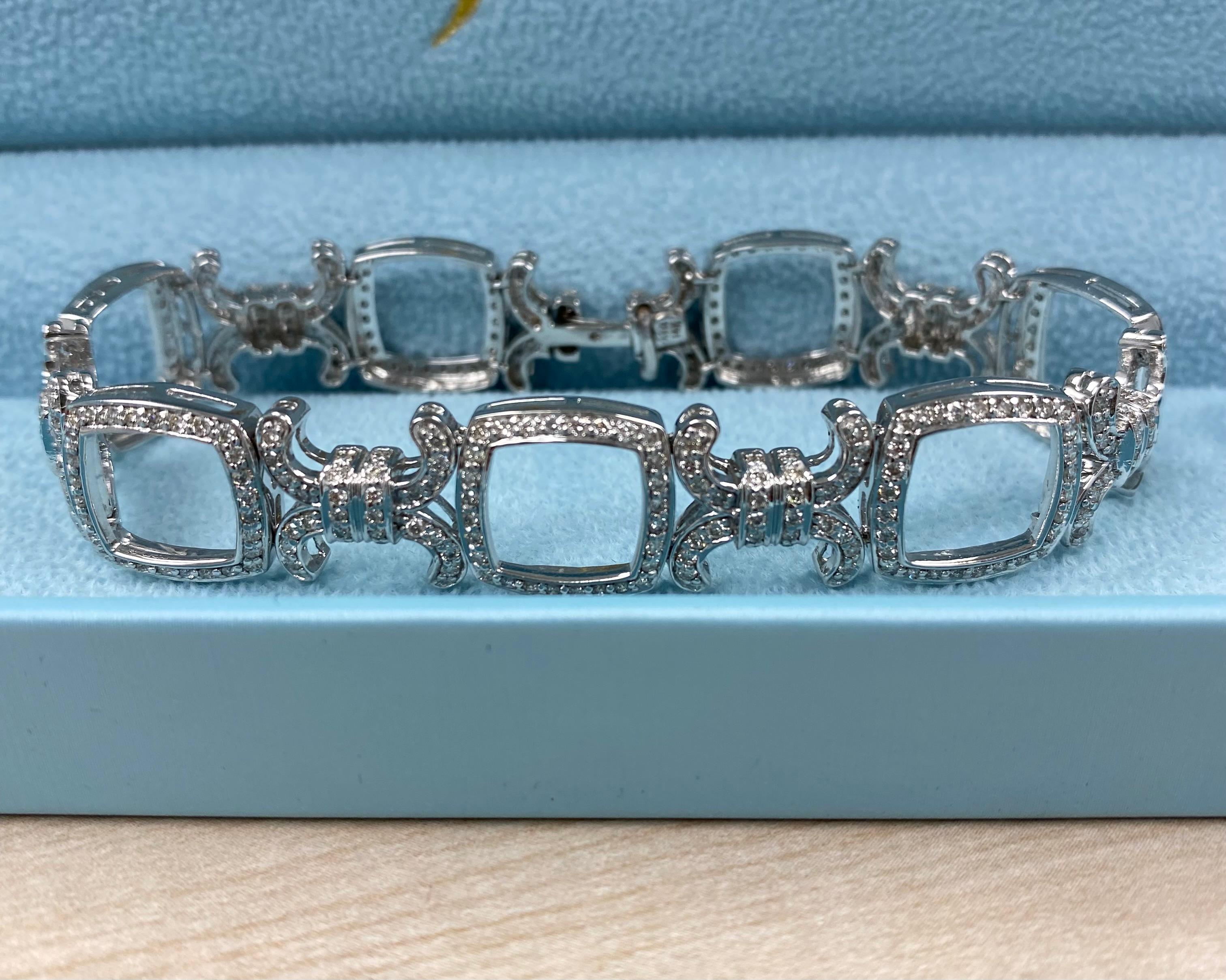 This stunning natural diamond XO link bracelet is crafted in 14k white gold and showcases 378 brilliant colorless round-cut diamonds with a total carat weight of 3.30. The diamonds, graded G/H in color and SI/I in clarity, are meticulously set in a
