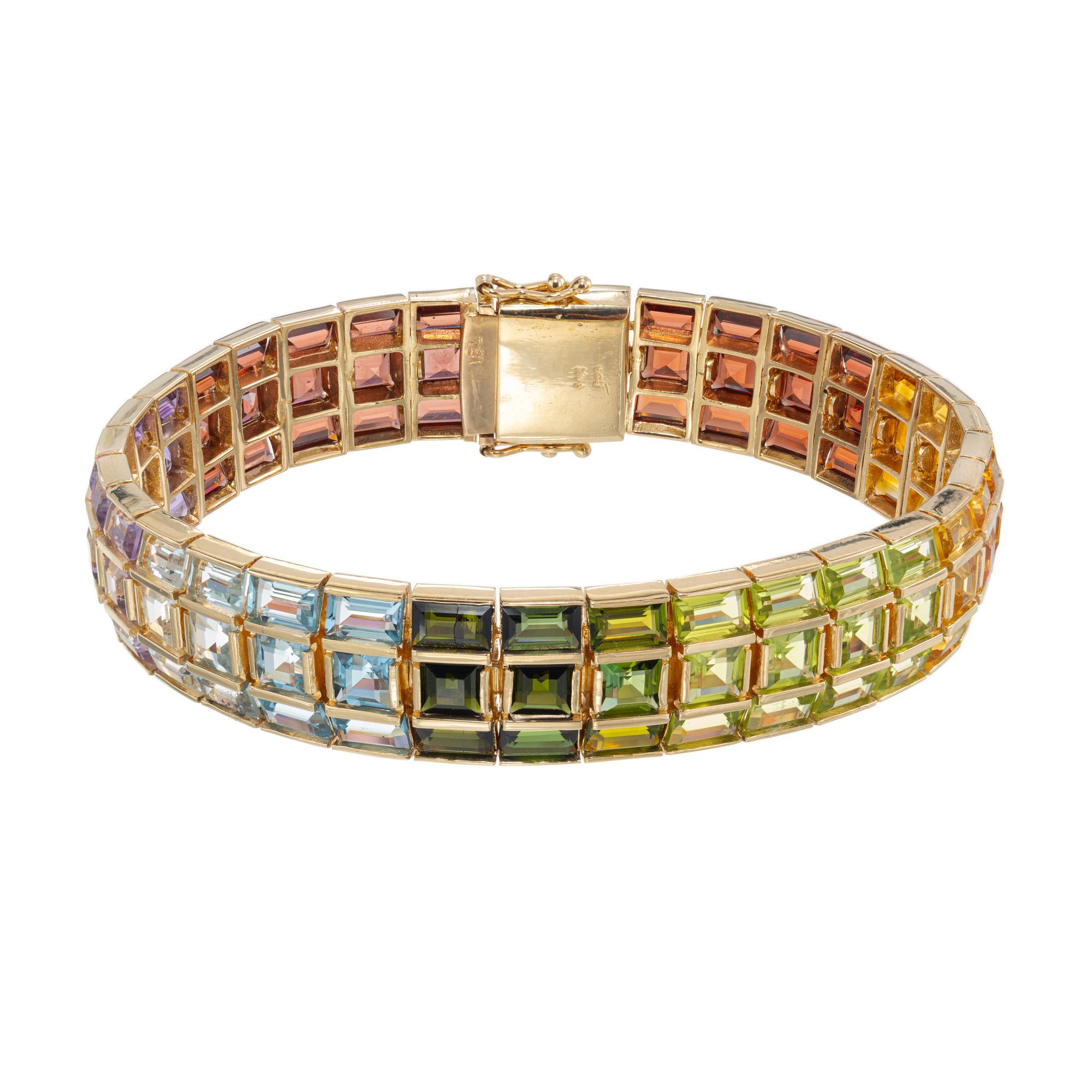 Indulge in the stunning elegance of our 33.00 Carat Garnet Citrine Amethyst Peridot Topaz Three Row Bracelet. This exquisite piece of jewelry is a true testament to the beauty and craftsmanship of nature. Each row showcases a dazzling array of