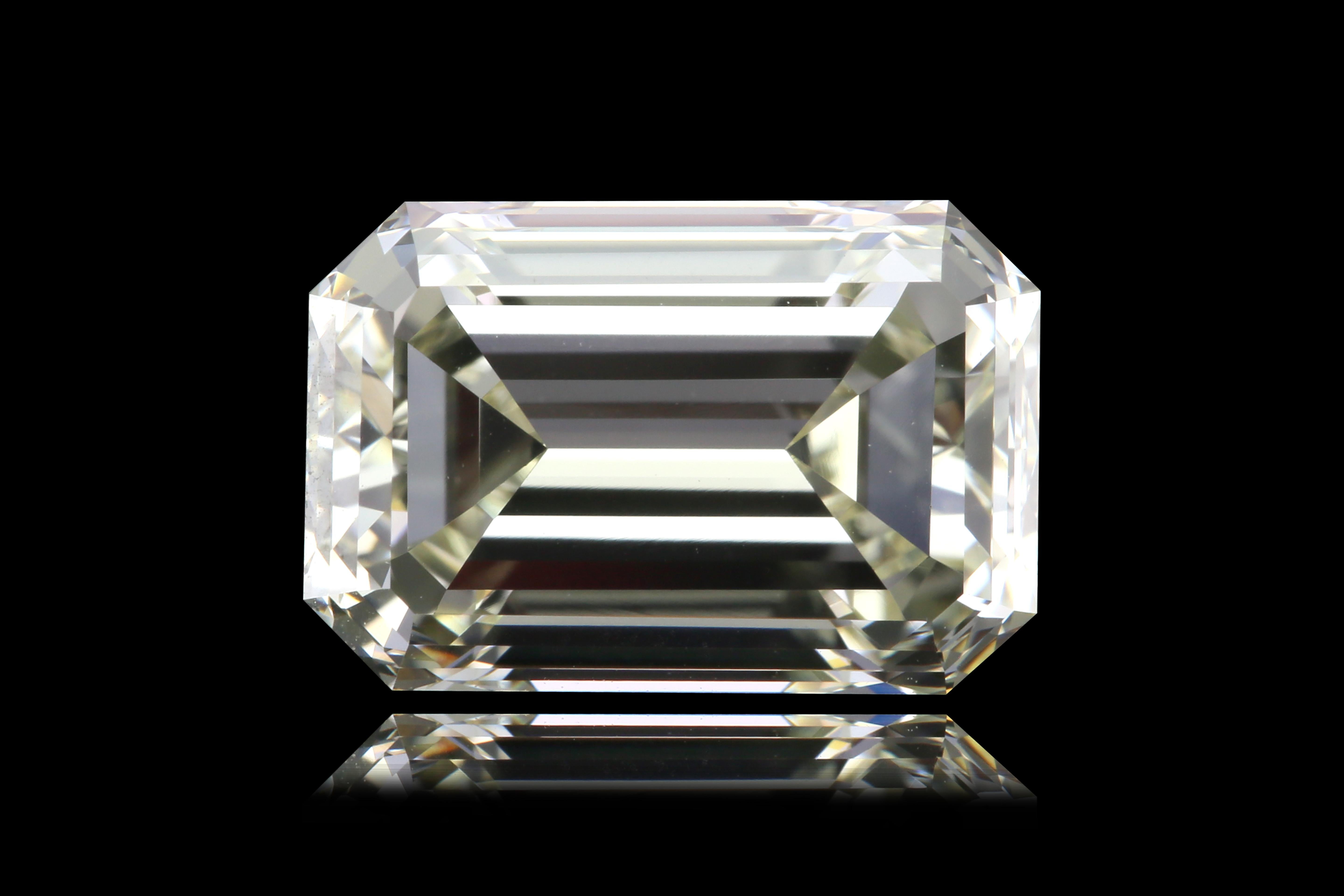 Presenting a truly captivating 3.31 carat emerald cut diamond, showcasing an elongated silhouette that exudes timeless elegance. This exceptional stone features an O-P color grade, imparting a warm, champagne-like hue that enhances its vintage