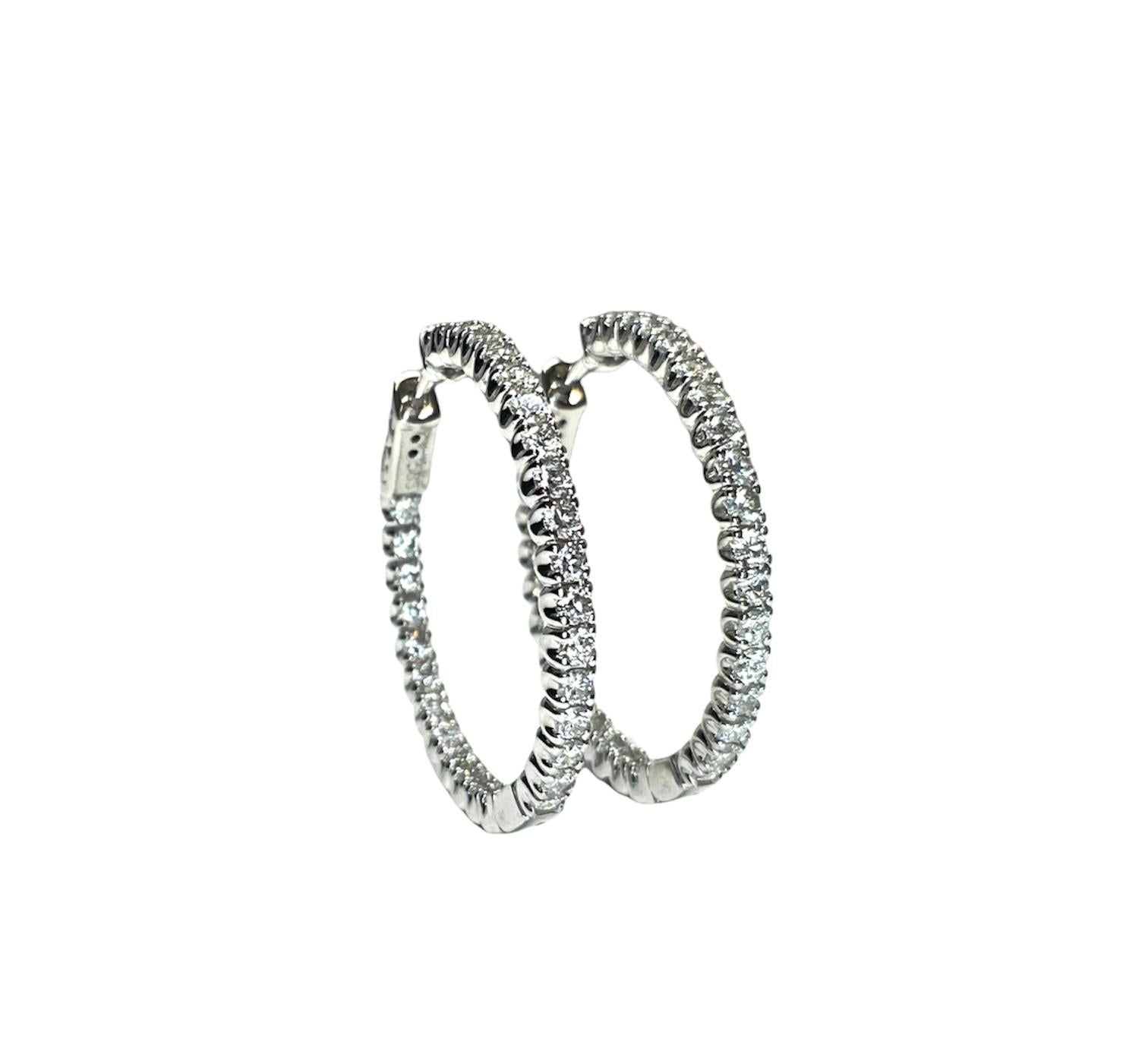 14k white gold diamond in and out hoop earrings feature 58 diamonds weighing 3.31 cts graded F-G, VS2-SI1 set in 14k white gold.
