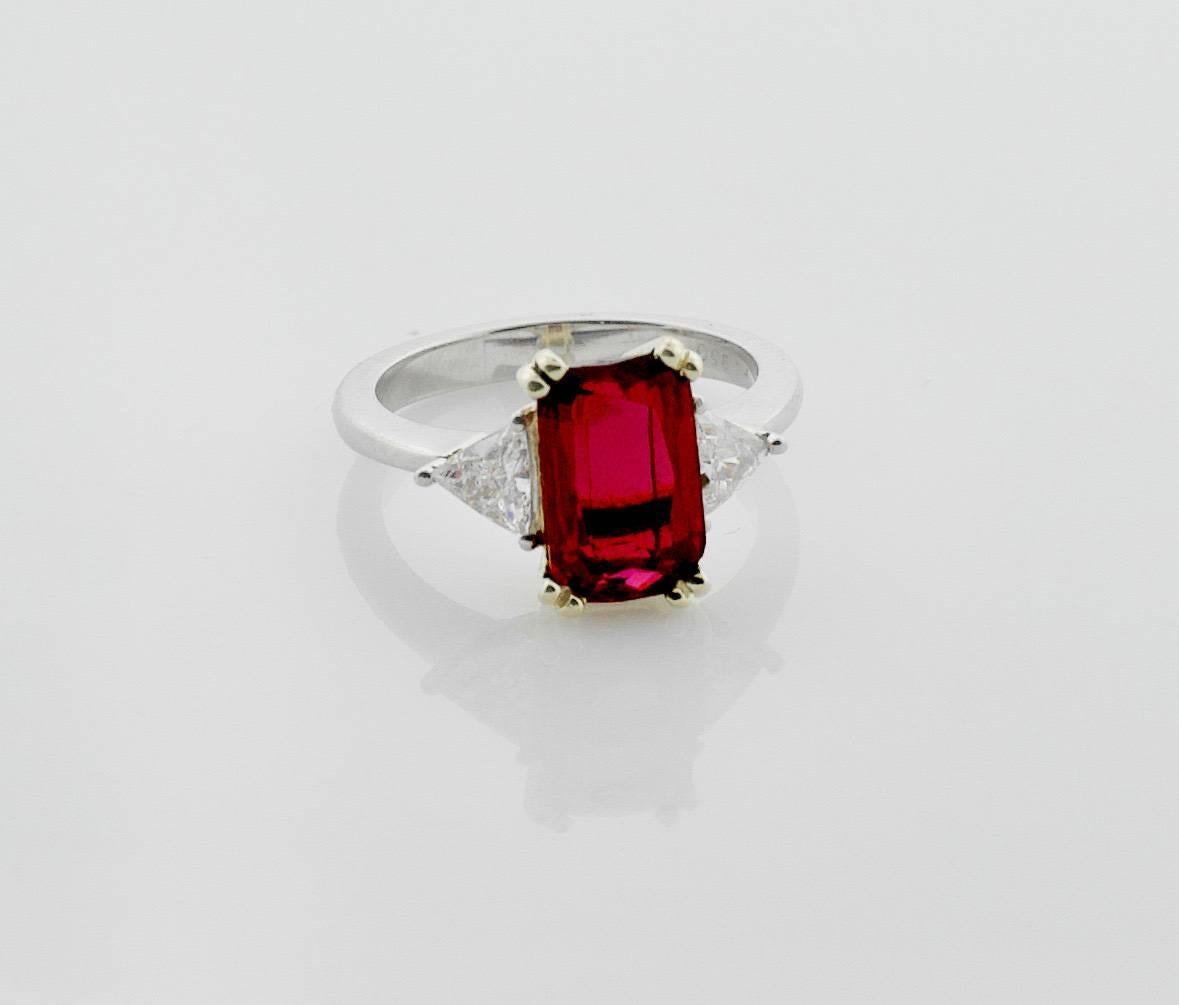 3.31 Emerald Cut Ruby and Diamond Solitaire Ring in Platinum and 18k GIA Certified
Handmade Classic Design
Ruby weighs 3.31  [bright with no imperfections visible to the naked eye]
Two Round Trillion Cut Diamonds weighing .48 carats 