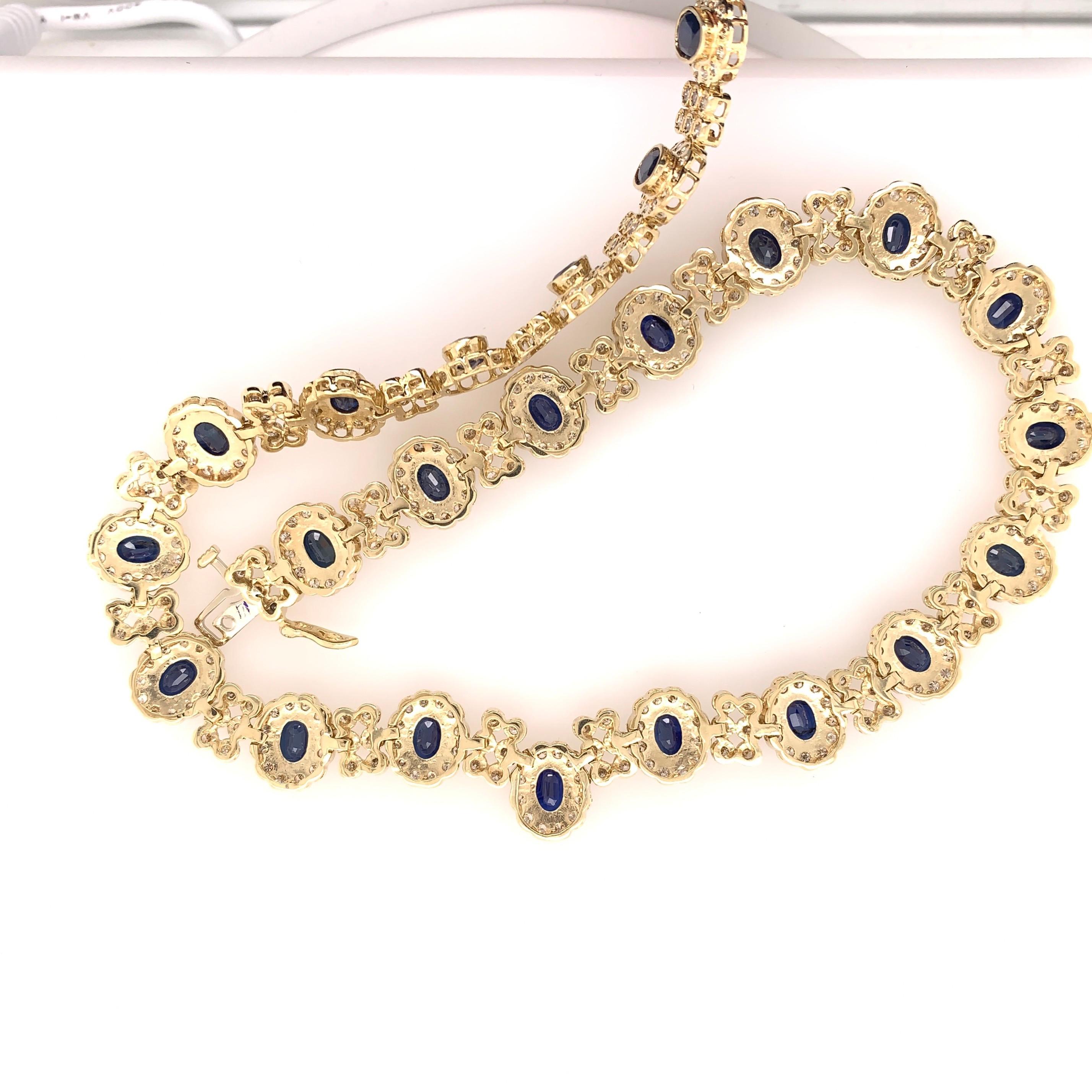 Women's Retro Gold 33.10 Carat Natural Oval Deep Blue Sapphire and Diamond Necklace 1970 For Sale