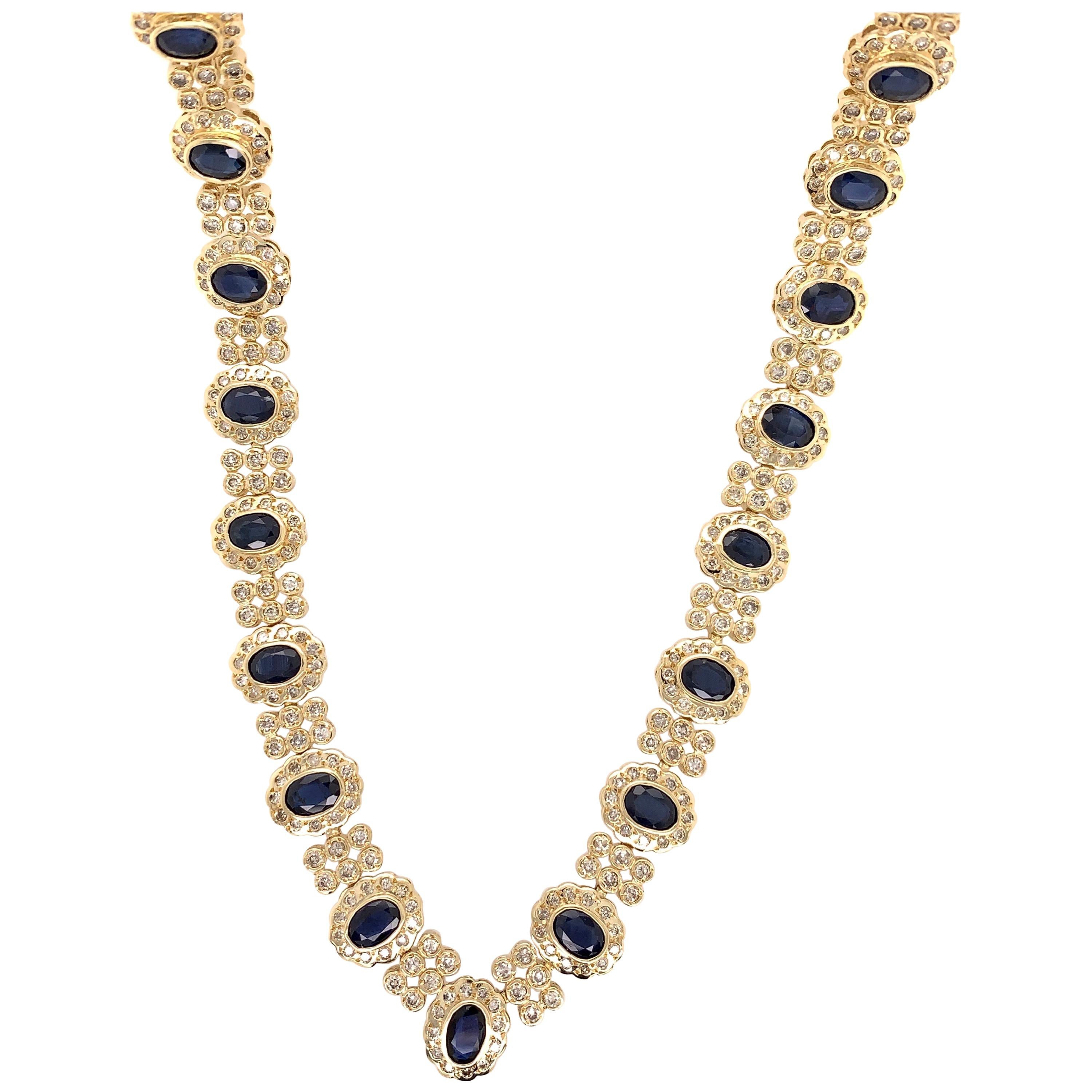 Retro Gold 33.10 Carat Natural Oval Deep Blue Sapphire and Diamond Necklace 1970 For Sale