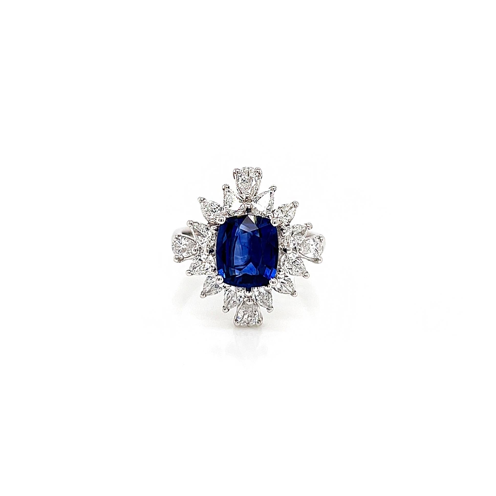 3.31 Total Carat Sapphire and Diamond Princess Diana Victorian Style Ladies Ring

-Metal Type: 18K White Gold
-2.05 Carat Cushion Cut Natural Blue Sapphire 
-1.26 Carat Pear Cut Natural Diamonds. E-F Color, VS Clarity 

-Size 6.5

Made in New York