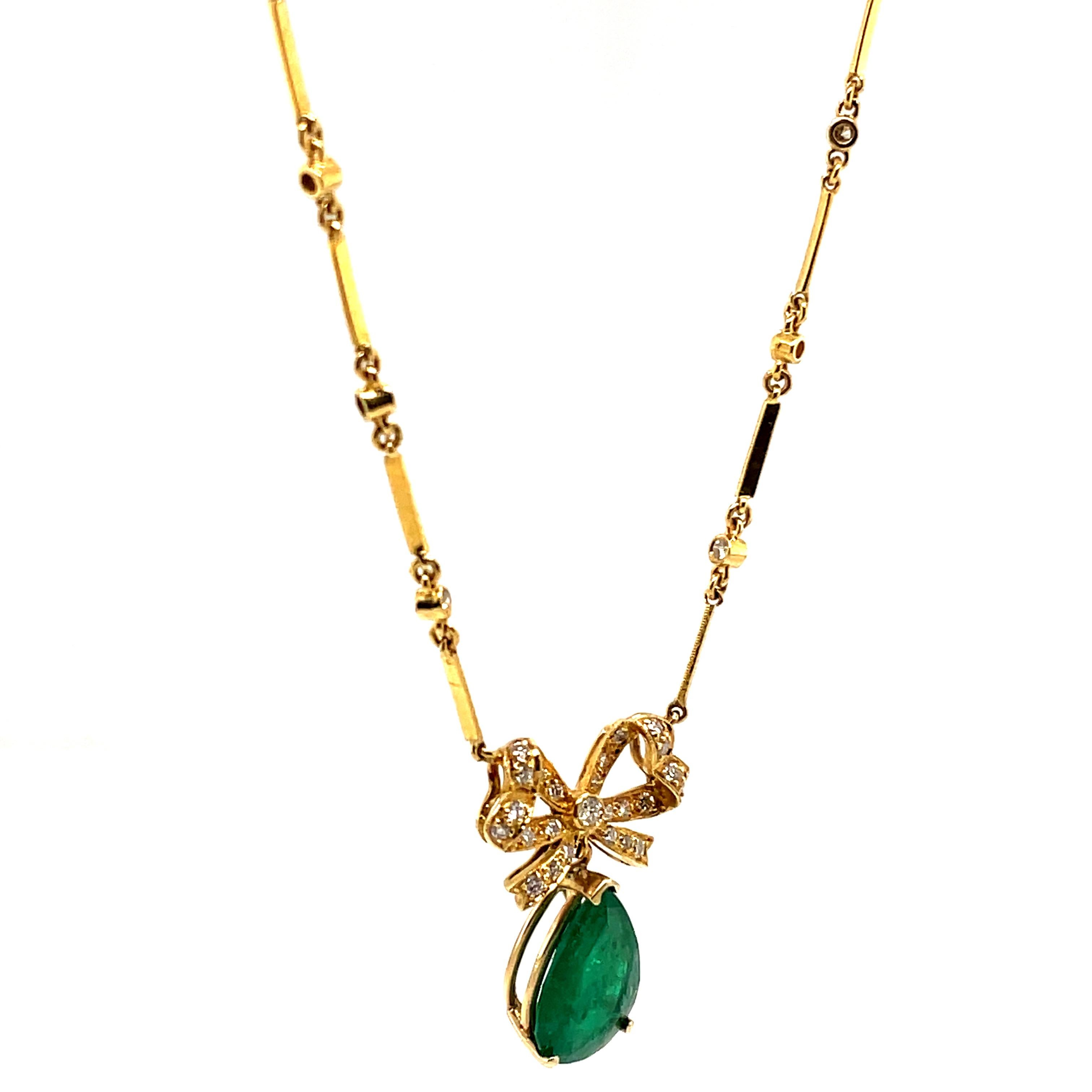 Contemporary 3.31ct Pear Emerald with Diamond Bow Necklace 18k Yellow Gold For Sale