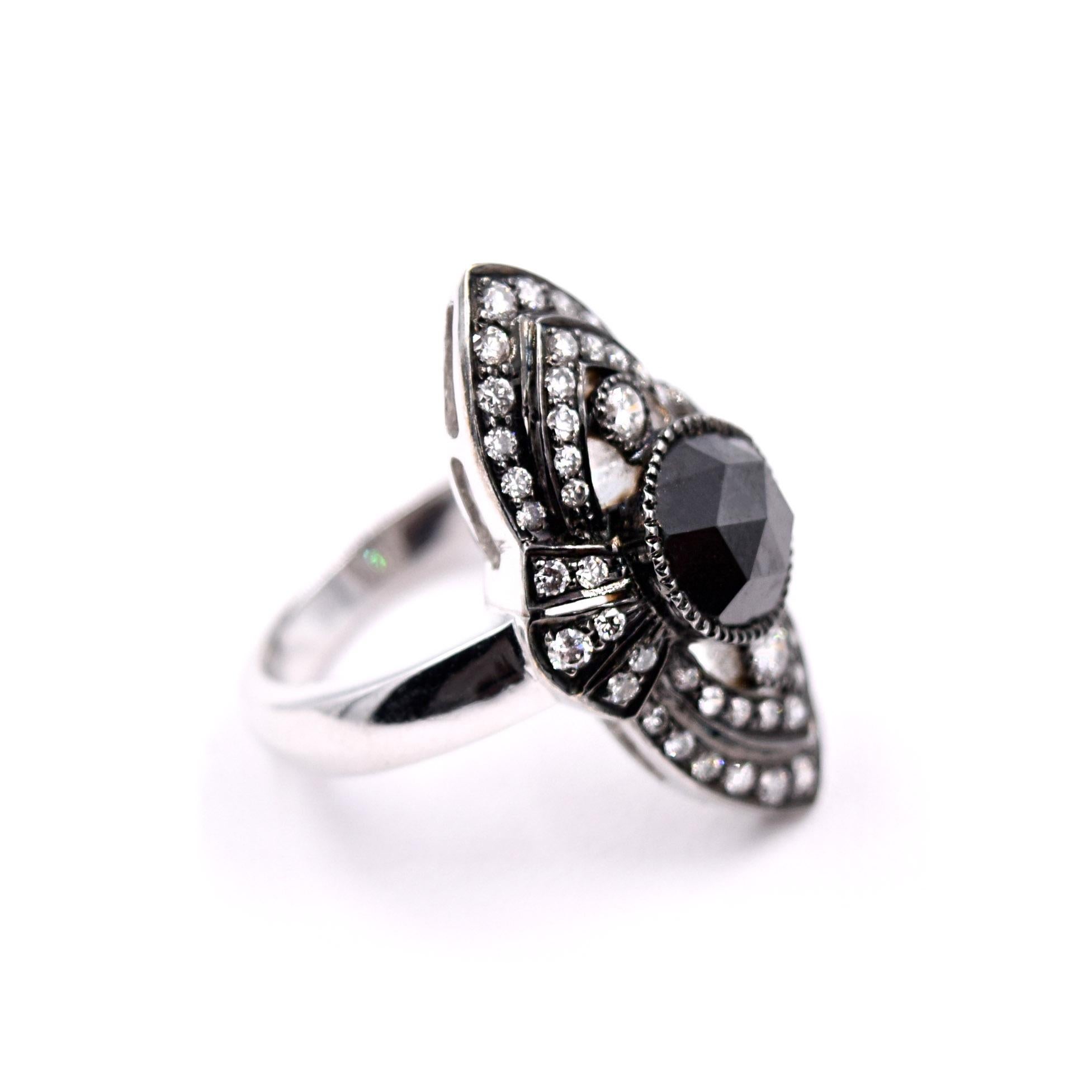 3.32ct black diamond and white diamond cocktail ring by Sethi Couture in 18K white gold and rhodium.
Ring is size 7 and can be sized.