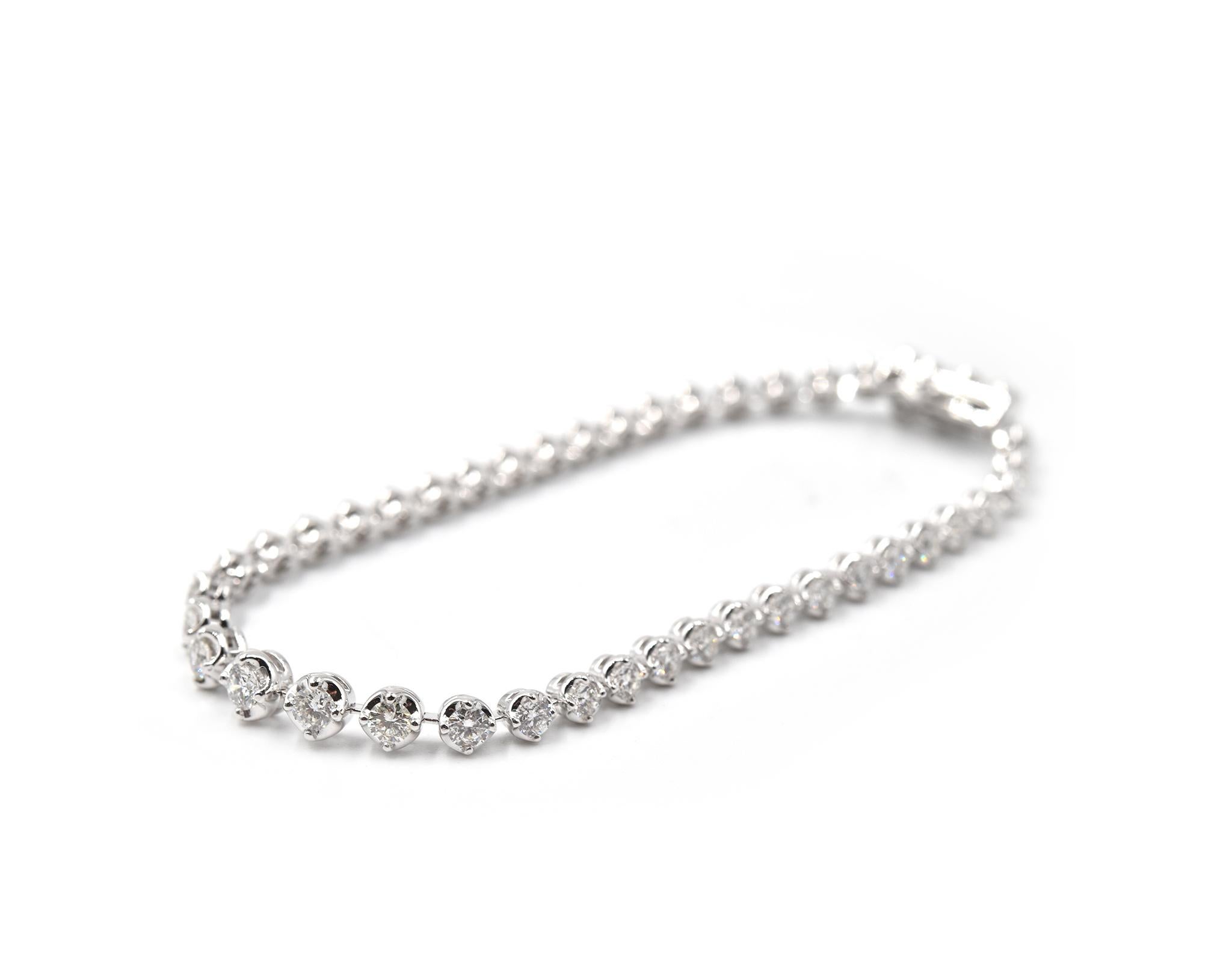 Material: 18k white gold
Diamonds: 43 round brilliant cut = 3.32 carat weight
Color: G
Clarity: SI1
Dimensions: bracelet is 7-inch long
Weight: 11.24 grams
