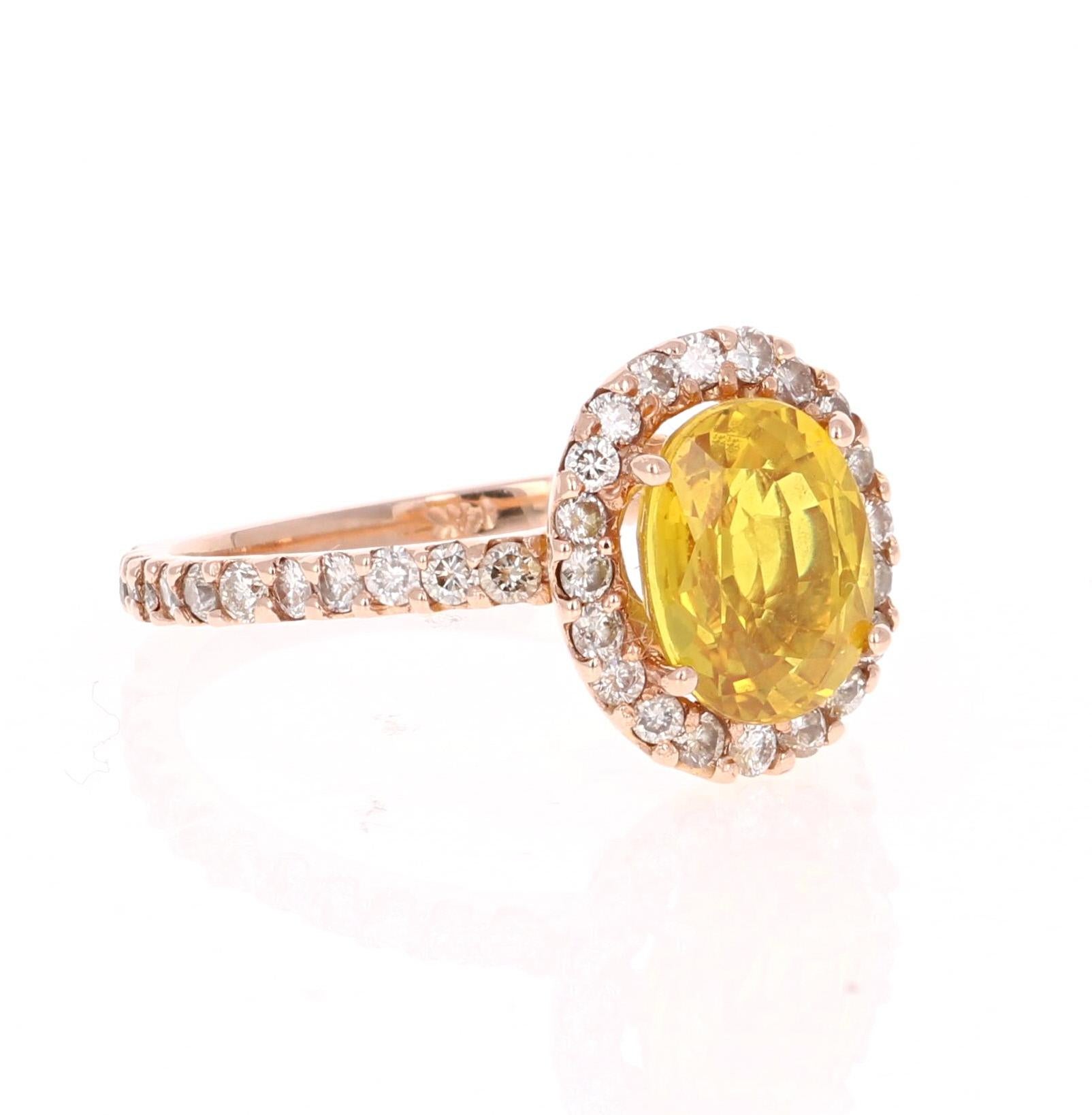3.32 Carat Yellow Sapphire Halo Diamond Rose Gold Engagement Ring

Yellow Sapphire Diamond Ring that can be a beautiful Engagement Ring. The Oval Cut Yellow Sapphire is 2.66 Carats. 
It has a halo of 30 Round Cut Diamonds that weigh 0.66 Carats. The