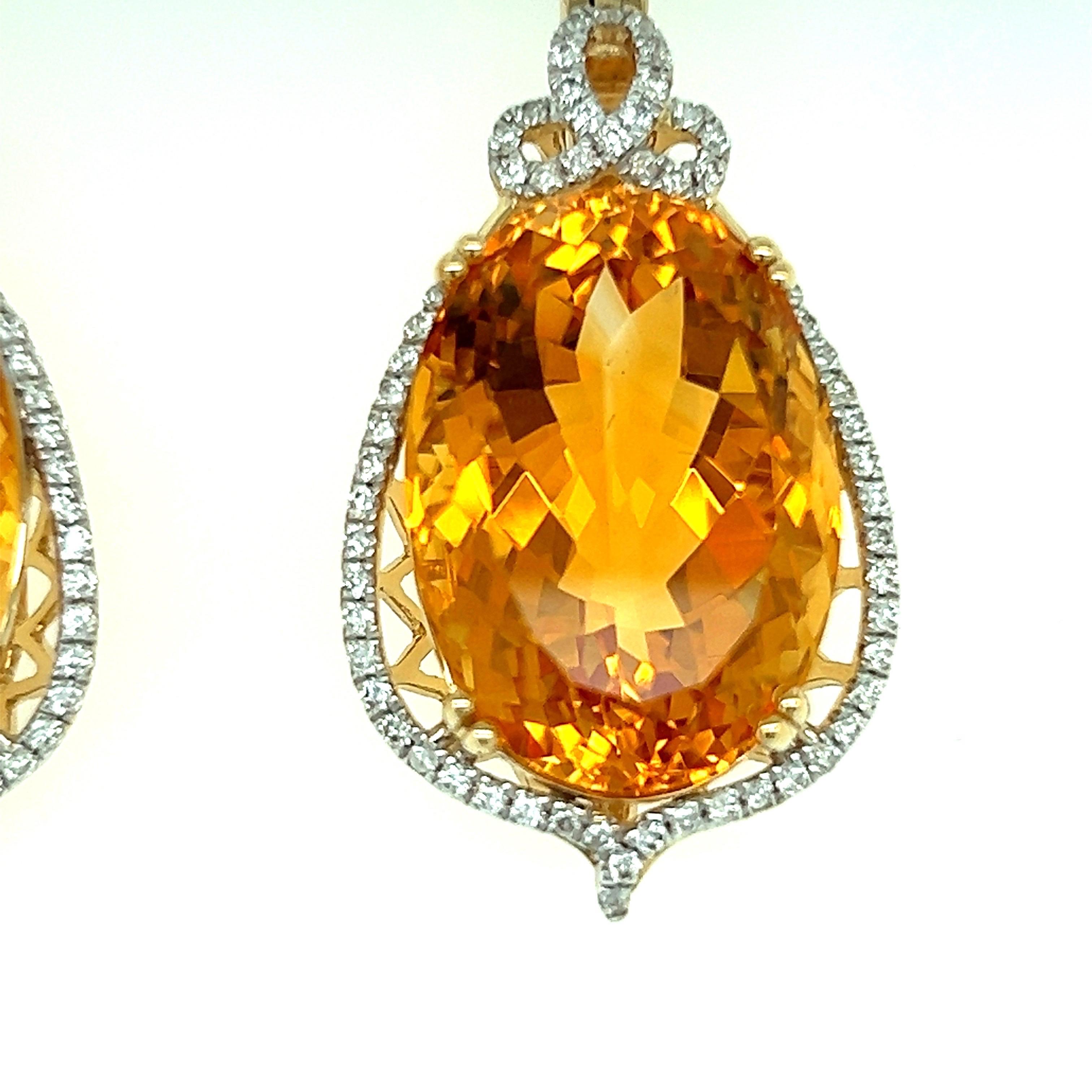 Elegant design. High brilliance, rich golden honey tone, oval faceted, matching natural 33.25 carats citrines mounted in high profile open basket with eight bead prongs, accented with round brilliant cut diamonds. Handcrafted master piece design set