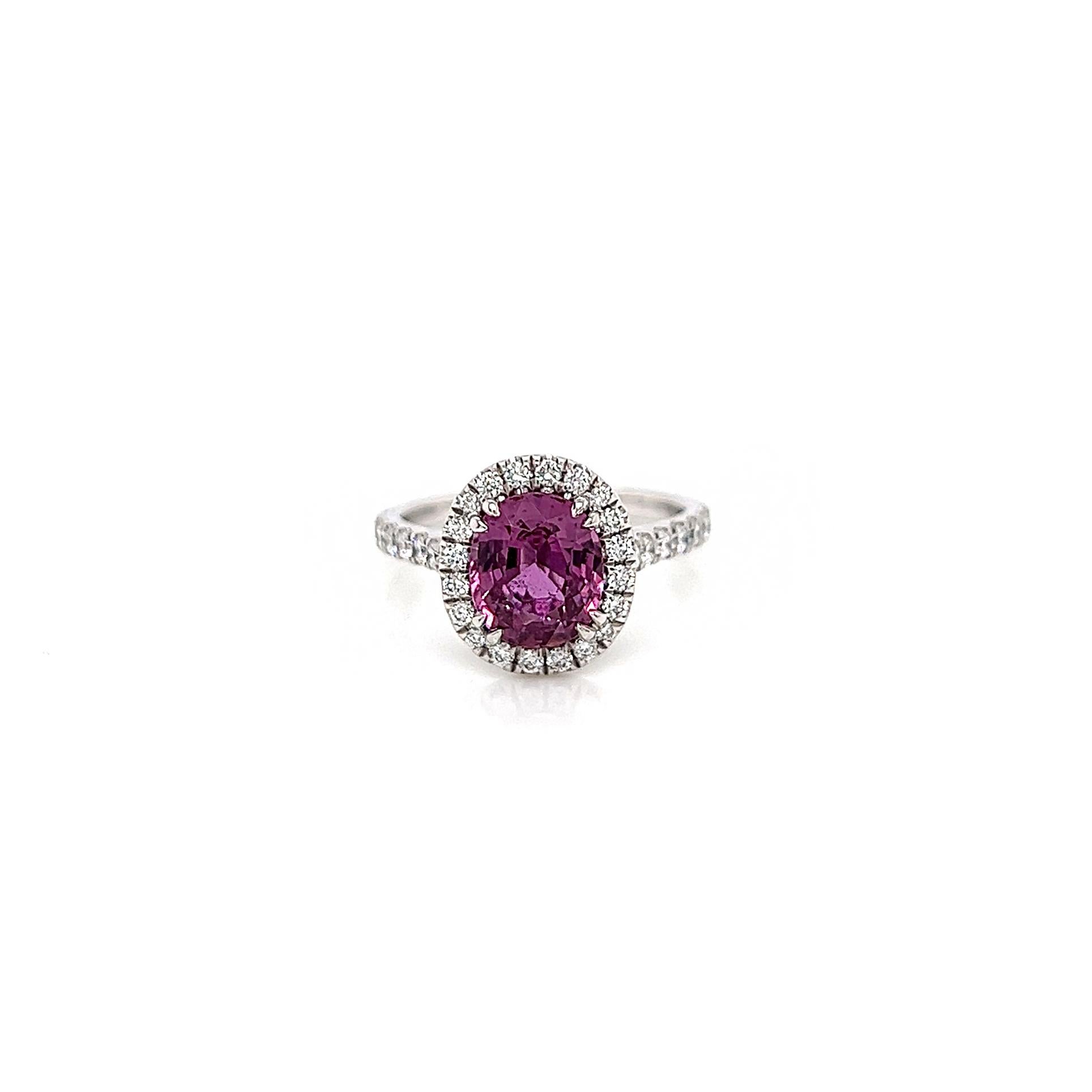 3.32 Total Carat Pink Sapphire and Diamond Halo Ladies Ring. GIA Certified.

-Metal Type: Platinum
-2.56 Carat Oval Cut Natural Sapphire, GIA Certified 
-Sapphire Color: Purplish Pink 
-Sapphire Measurements: 8.56 x 7.28 x 4.73 mm
-0.76 Carat Round