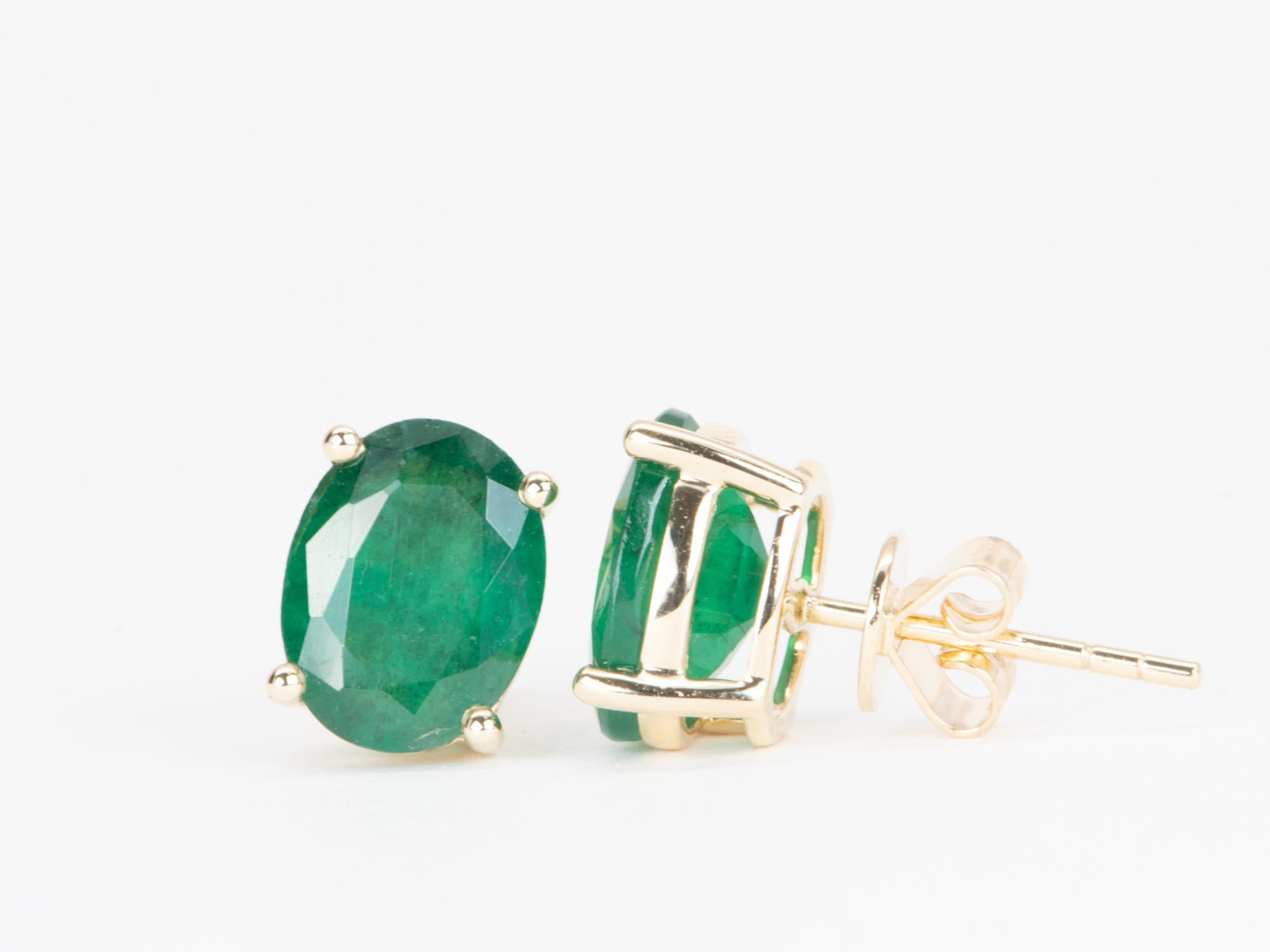   Make a bold, timeless statement with these beautiful 3.32ct oval emerald and 14K gold stud earrings! Show off your impeccable taste with natural emeralds, whose brilliant green hue will add instant sophistication to your everyday look. A brilliant