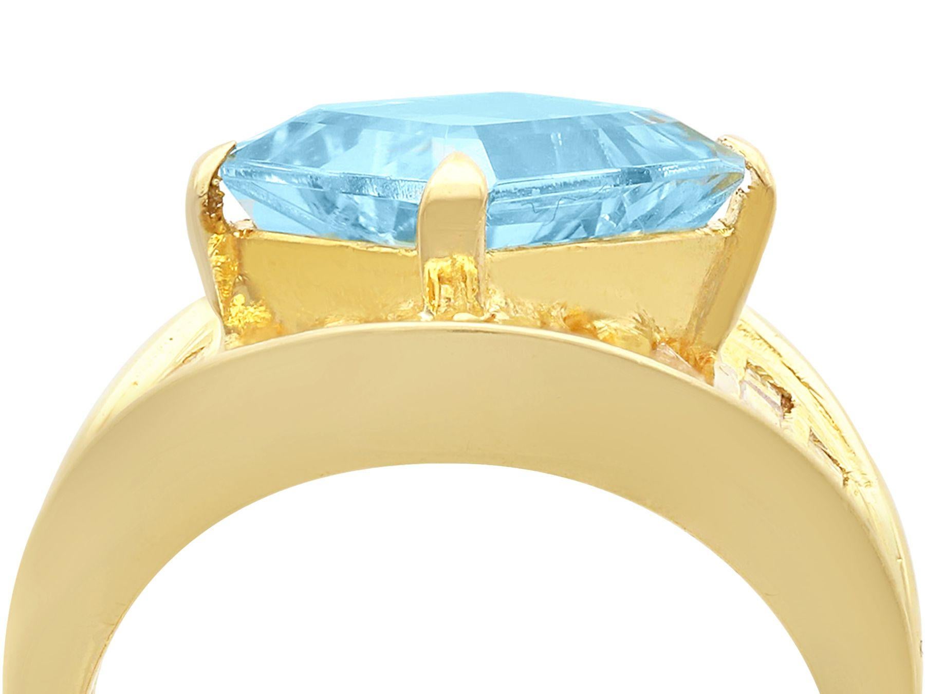 A stunning, fine and impressive 3.33 carat aquamarine and 1.55 carat diamond, 18 karat yellow gold dress ring; part of our diverse aquamarine jewellery collections.

This stunning, fine and impressive contemporary aquamarine ring has been crafted in