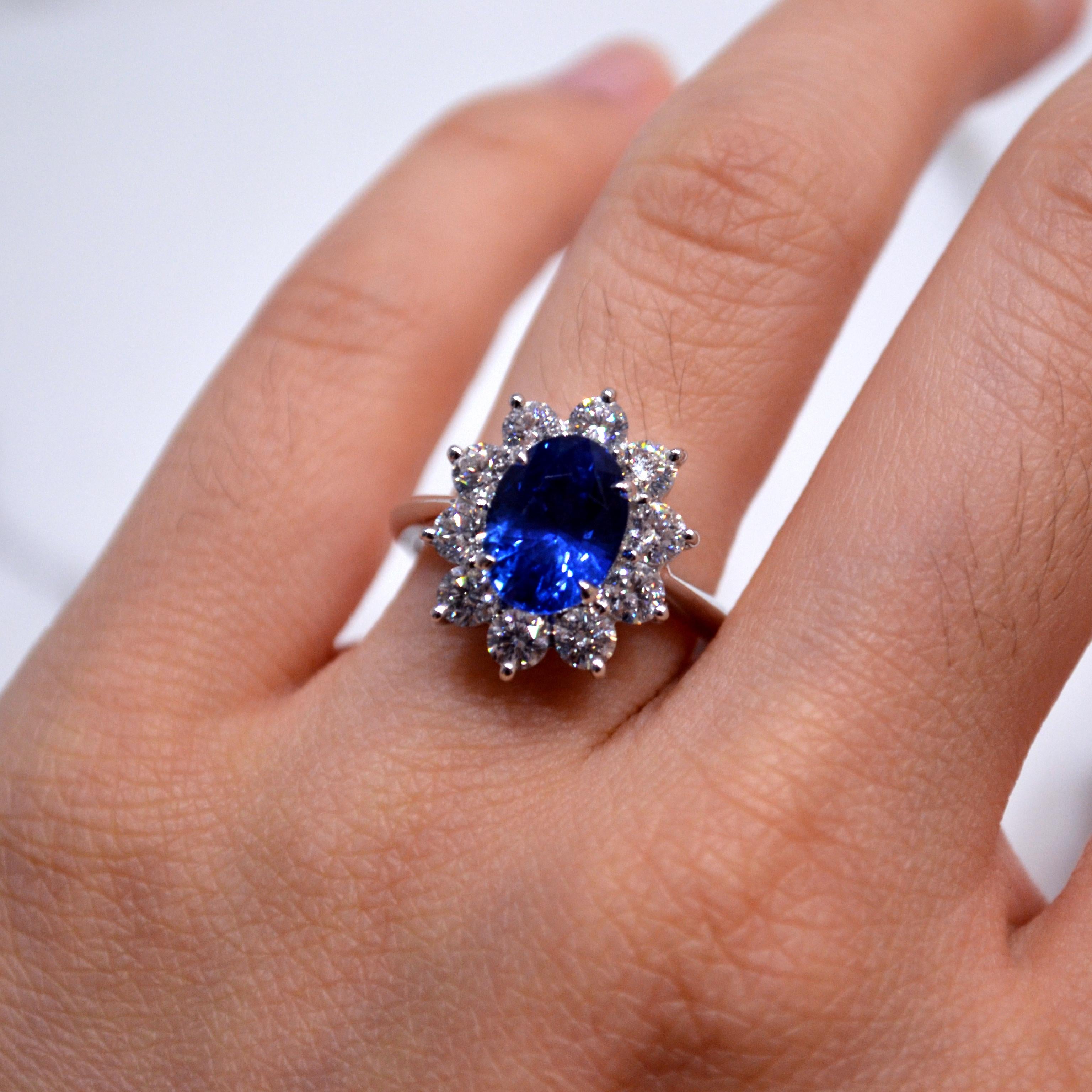 Princess Diana Style Ring in 18K white gold set with an oval cut Ceylon Blue Sapphire (3.33 carat) and 10 round brilliant cut Diamonds (1.25 carats)

Ring US size 6.5
*Complimentary resizing service*