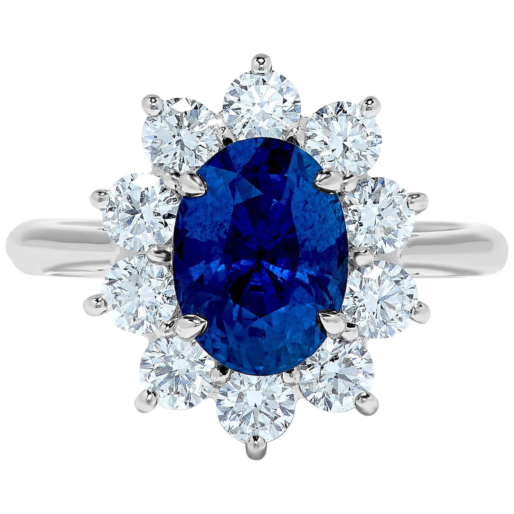 3.33 Carat Ceylon Blue Sapphire Diamond Halo 18 Karat Gold Princess Diana Ring For Sale