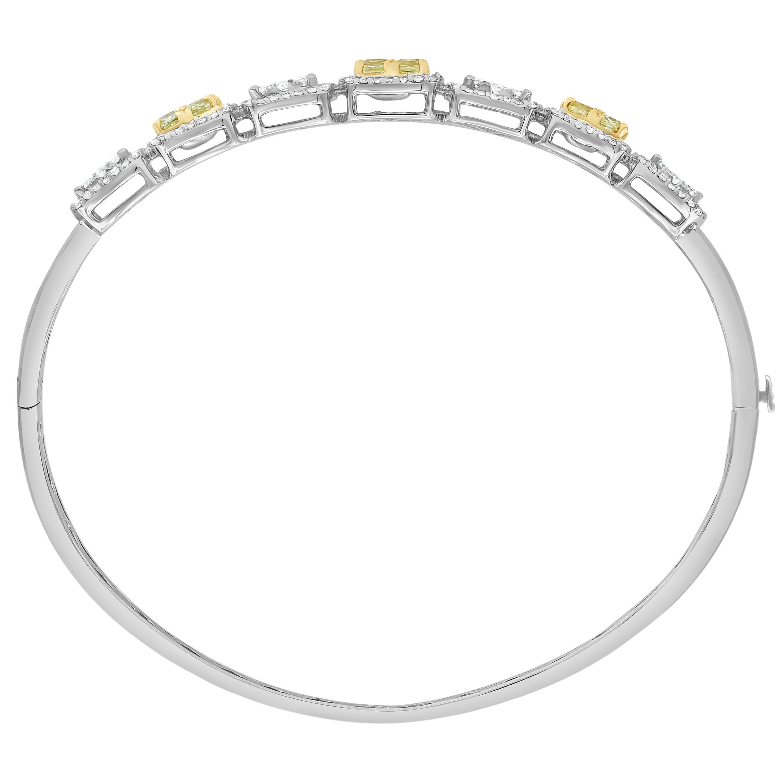Wrap your wrist in this spectacular diamond bangle bracelet. Crafted in cool 18K white gold, this design showcases paired Cushion-cut diamonds Color IS Treated Yellow & Clarity is SI1-SI2 wrapped in Square-shaped frames of round diamonds with Color