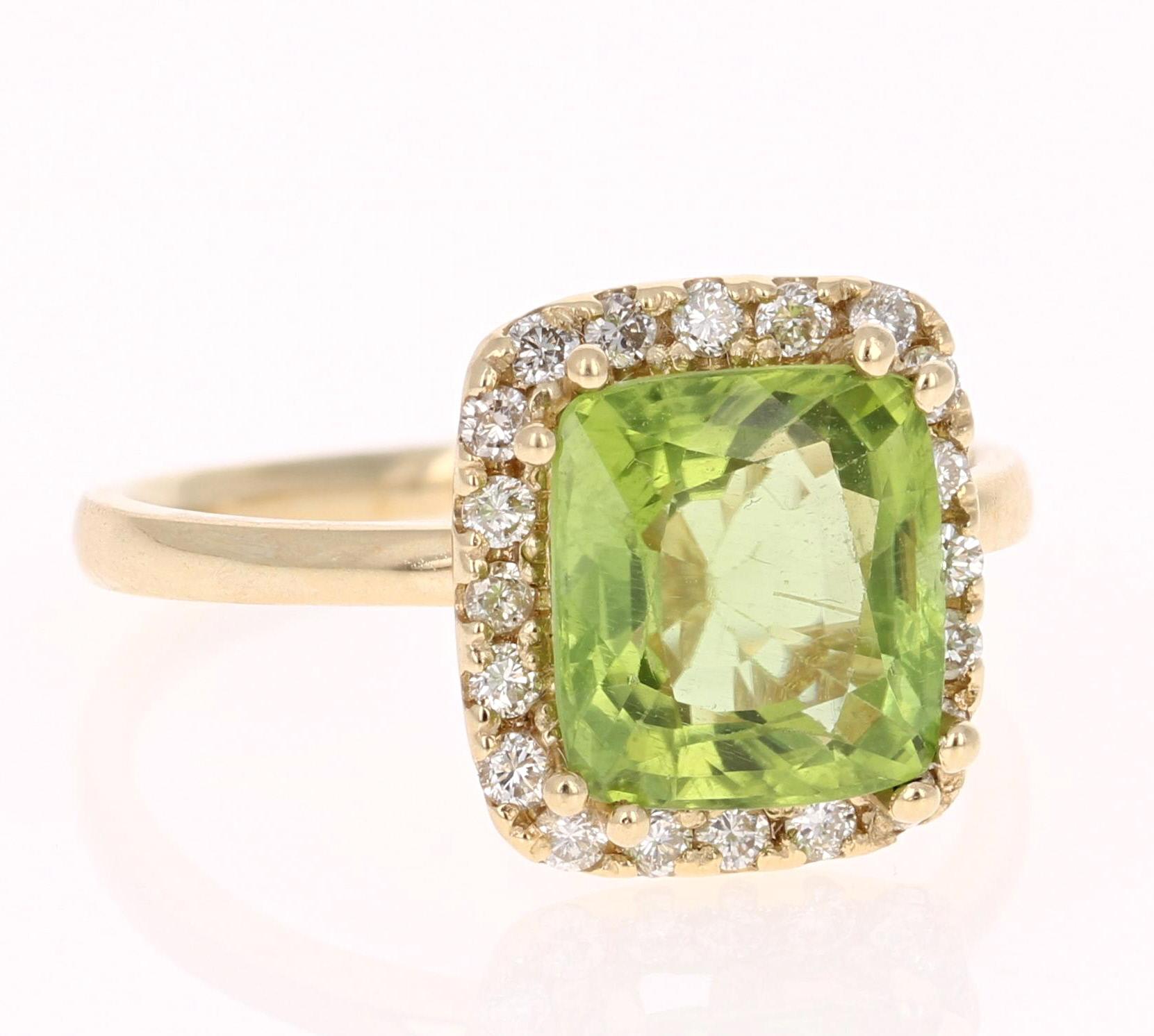 3.33 Carat Peridot Diamond Engagement Yellow Gold Ring - this can be a stunning and unique alternative to an engagement ring!

This beautiful ring has a Peridot in the center that weighs 3.02 carats. The ring is surrounded by a gorgeous halo of 20