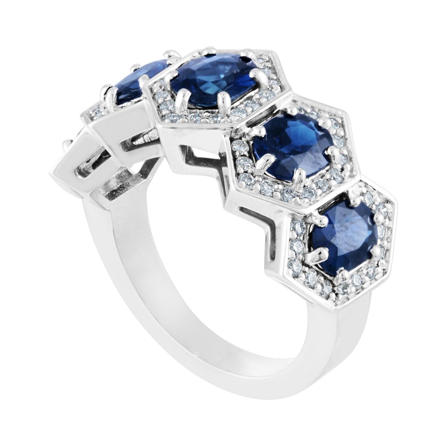 Five Stone Hexagon Band Ring
The ring is 14K White Gold
The ring has 5 Oval Sapphires 3.33 Carats
The ring has 0.50 Carats Diamonds F/G VS
The ring is a size 7.00, sizable up only.
The ring weighs 8.6 grams