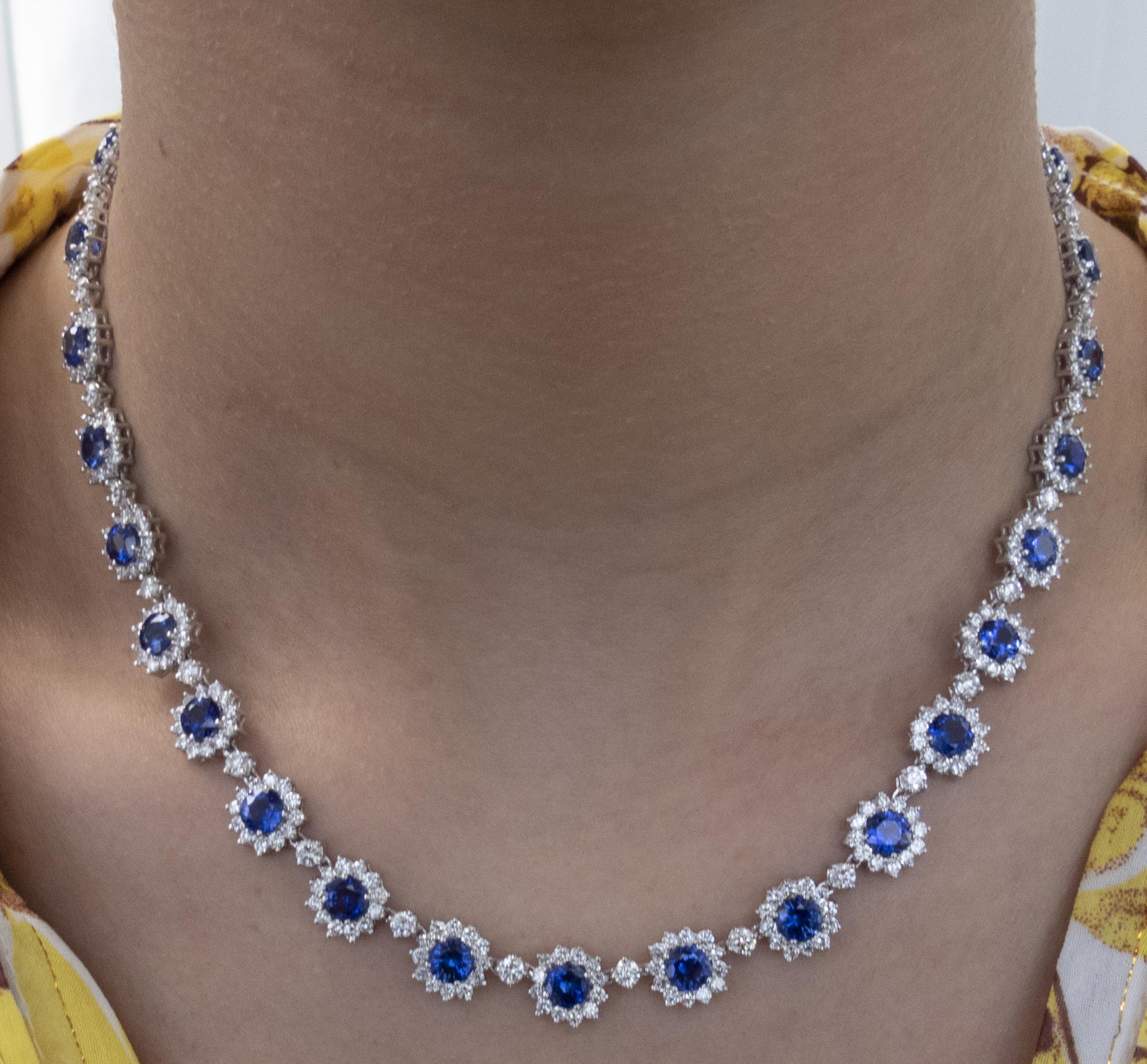 Sensational Diamond and Sapphire necklace finely crafted in 18K white gold, featuring Blue Sapphires and white diamonds weighing approximately 33.34 carats total. This exceptional necklace showcases 416 round brilliant cut diamonds weighing 21.79