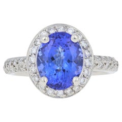 Vintage 3.34 Carat Oval Cut Tanzanite and Diamond Ring, Platinum Milgrain Halo