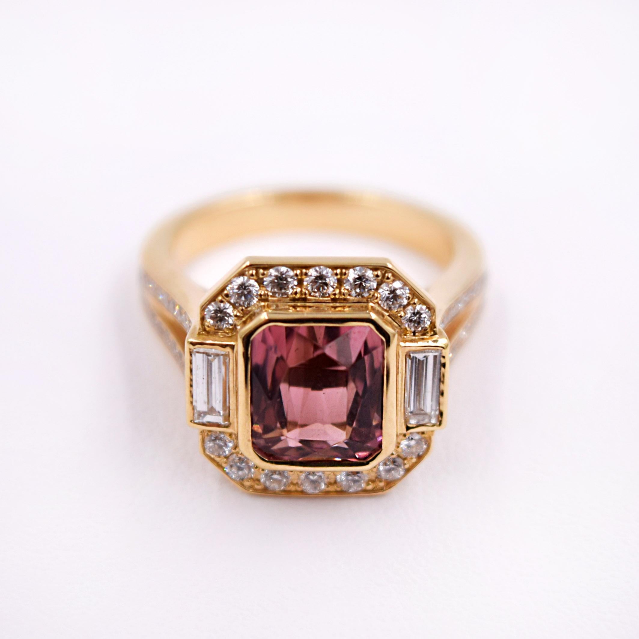 - Designed by Carl Priolo
- Cushion Cut Pink Tourmaline 3.34 Carat
- 0.79 Carats of White Diamonds
- 18K Yellow Gold
- Size 6.5 and can be sized