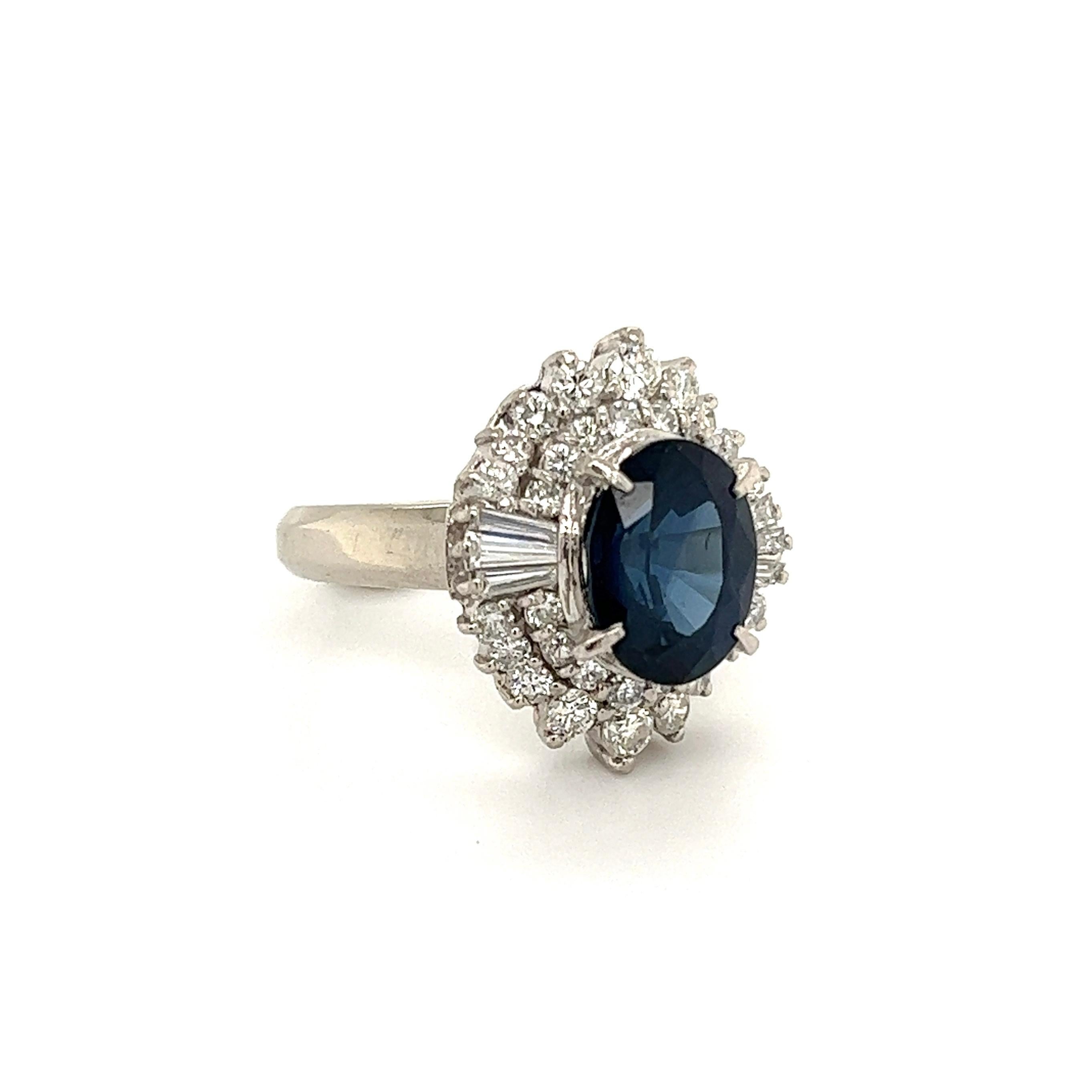 Simply Beautiful! Blue Sapphire and Diamond Art Deco Revival Platinum Ring. Centering a securely set Oval Sapphire, weighing approx. 3.34 Carat, surrounded by Diamonds, weighing approx. 1.00tcw. Hand crafted Platinum mounting. Approx. Dimensions: