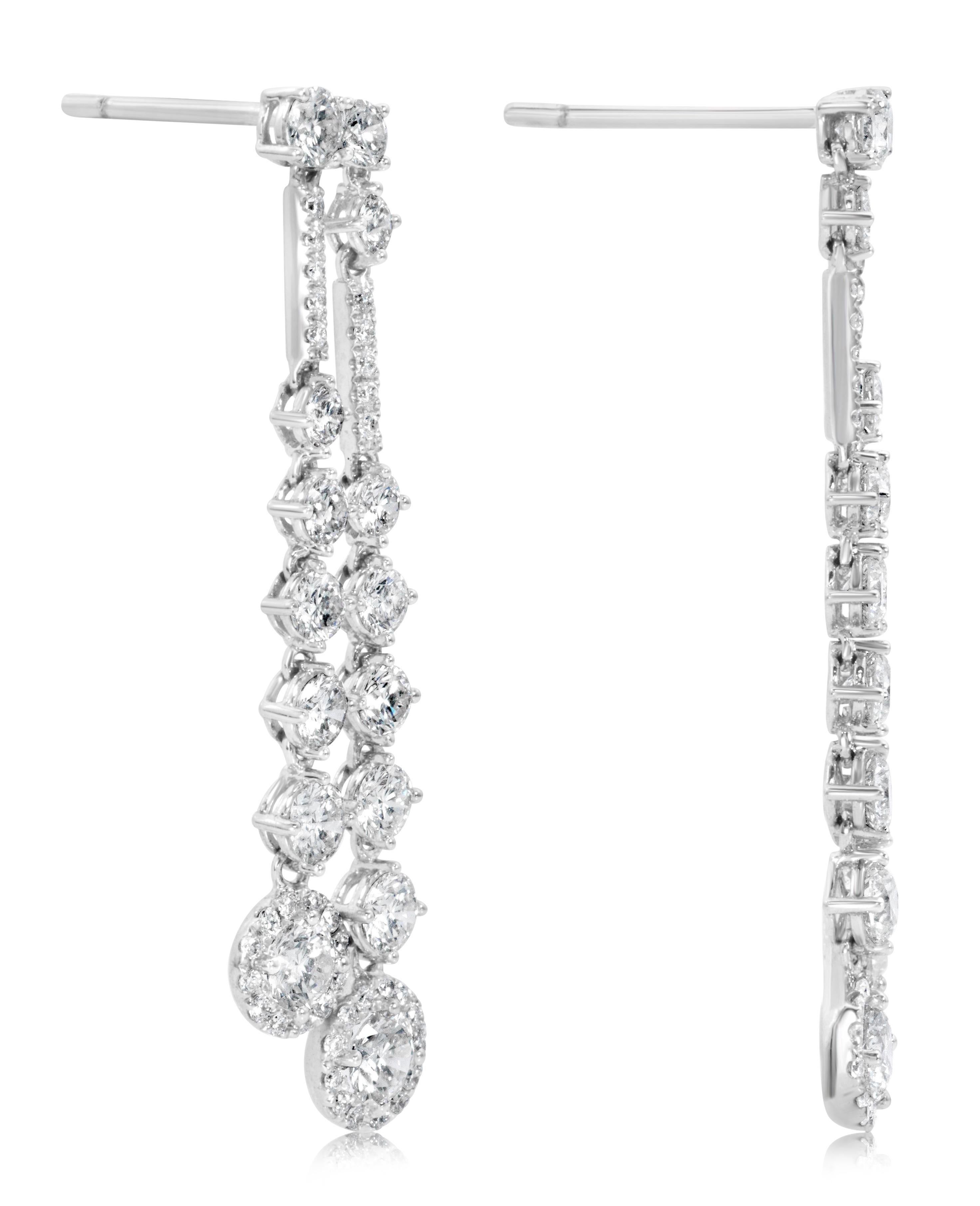 A classy pair of drop earrings, featuring round brilliant cut diamonds weighing 3.34 carats total with E-F Color and VS-VVS Clarity. Finely set on 18K white gold. Perfect for casual or formal wear.  

Roman Malakov is a custom house, specializing in