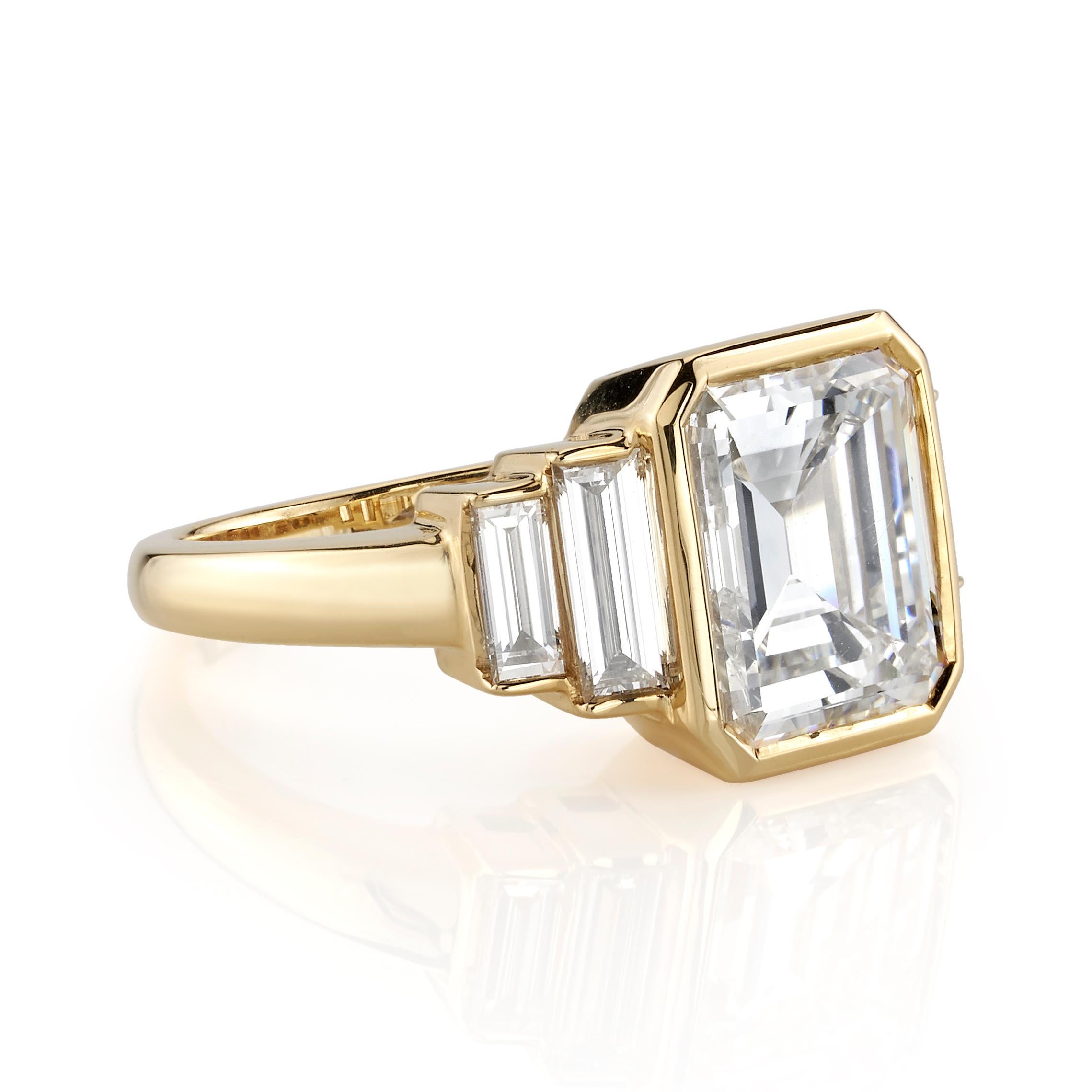 3.34ct F/VS1 GIA certified Emerald cut diamond with 0.71ctw baguette accents set in a handcrafted 18K yellow gold mounting. Ring is currently a size 6 and can be sized to fit.
