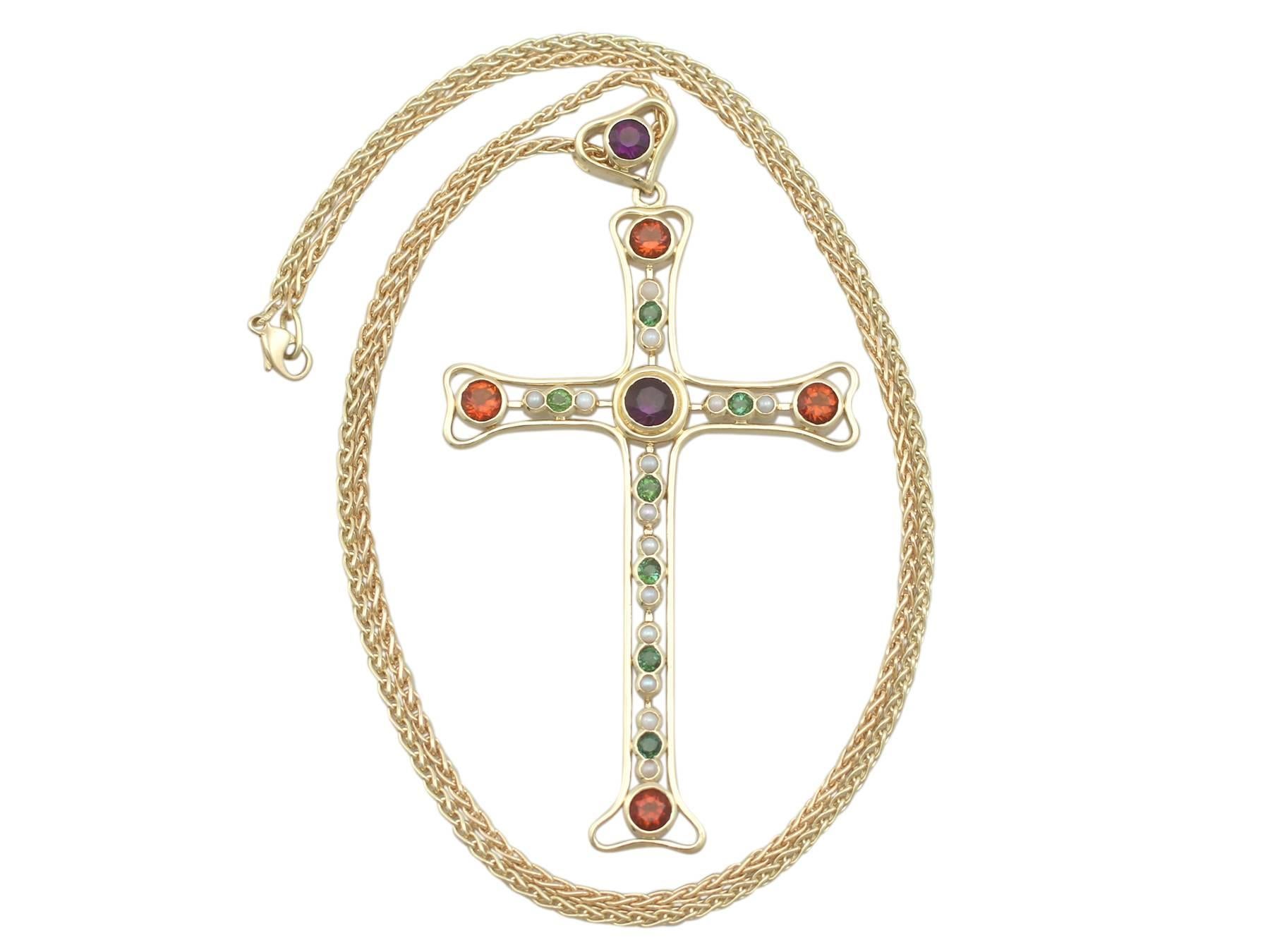 A stunning, fine and impressive vintage 3.35 carat amethyst, peridot, citrine and seed pearl, 18 karat yellow gold cross pendant; part of diverse vintage jewelry collections.

This stunning, fine and impressive Boodles cross pendant has been crafted