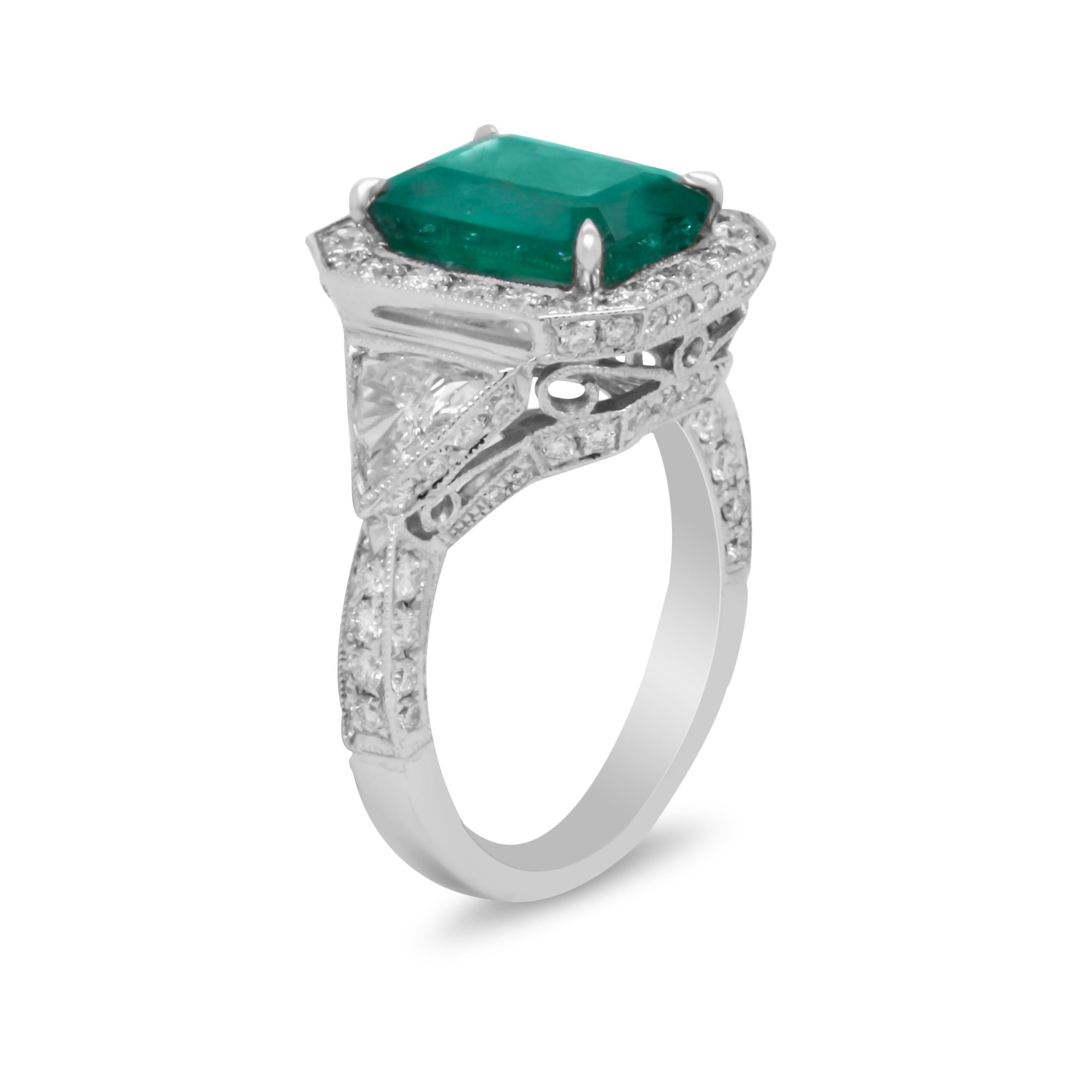 18k White Gold and Diamond Cocktail Ring with Colombian Emerald Center and Trillion Cut Diamonds

This natural Colombian Emerald center features two 0.50 carat each trillion cut diamonds on both sides along with diamonds set along the entire