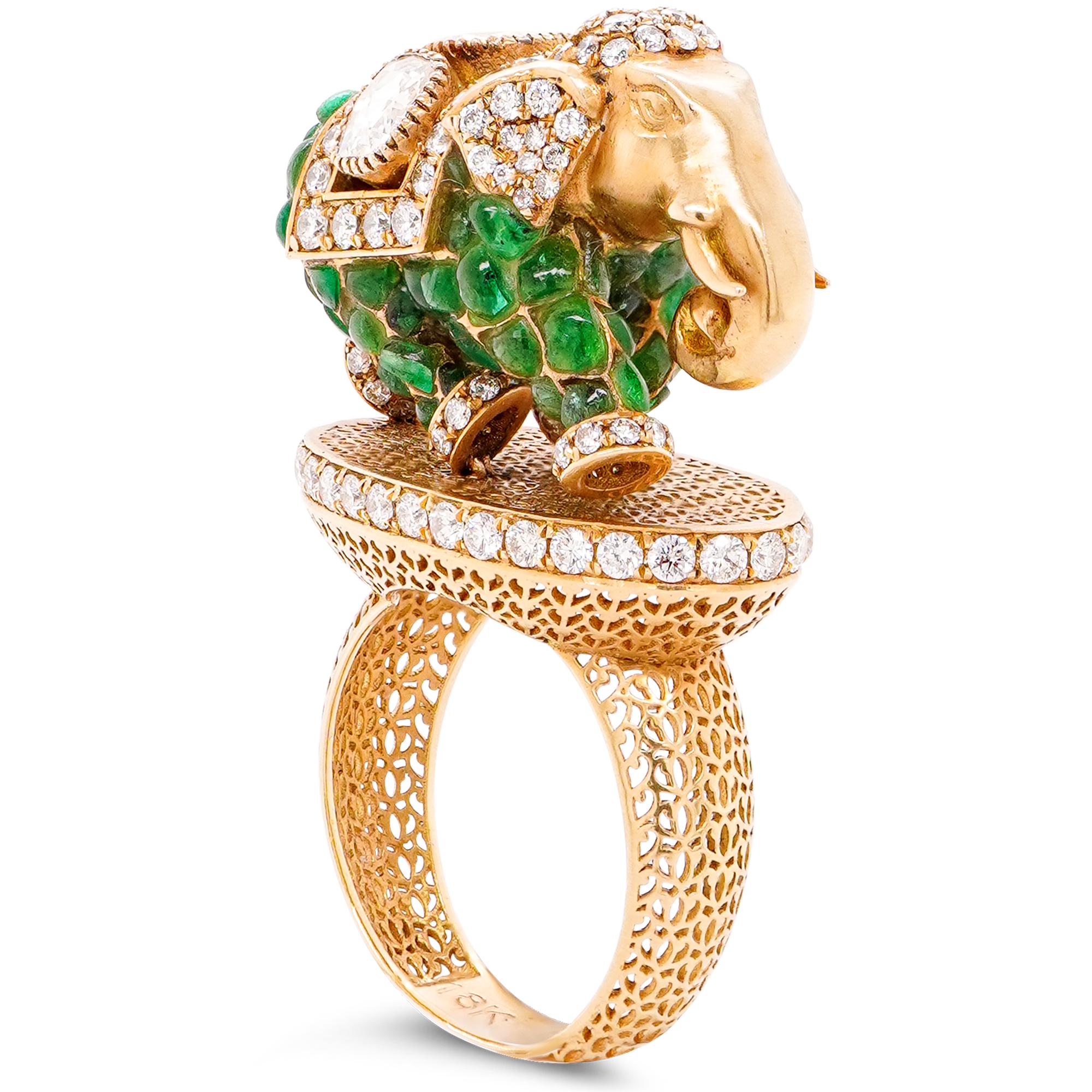 This stunning 18K gold ring is a masterpiece of elegance and artistry, featuring a 3.35-carat emerald and 2.36 carats of dazzling white diamonds in a unique and captivating “Graceful Walk Elephant” design. Perfectly blending luxury with meaningful