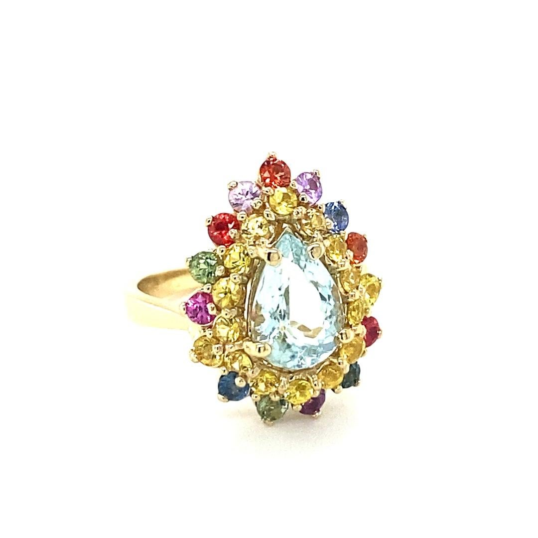 3.35 Carat Pear Cut Aquamarine Sapphire Diamond Yellow Gold Cocktail Ring

This ring has a gorgeous 1.65 Carat Pear Cut Aquamarine and is surrounded by 30 Round Cut Multi-Colored Sapphires that weigh 1.70 Carats.  The Aquamarine and Sapphires are
