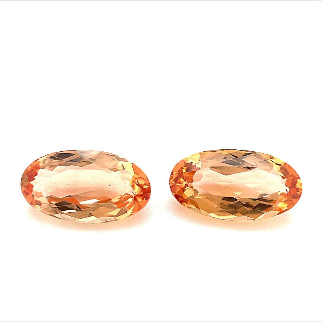 This pair of peachy color imperial topaz would make a stunning pair of earrings, or perhaps a matching ring and pendant! Measuring approximately 10.25 x 5.50mm, they are beautifully cut elongated ovals that have eye-catching sparkle and life. They