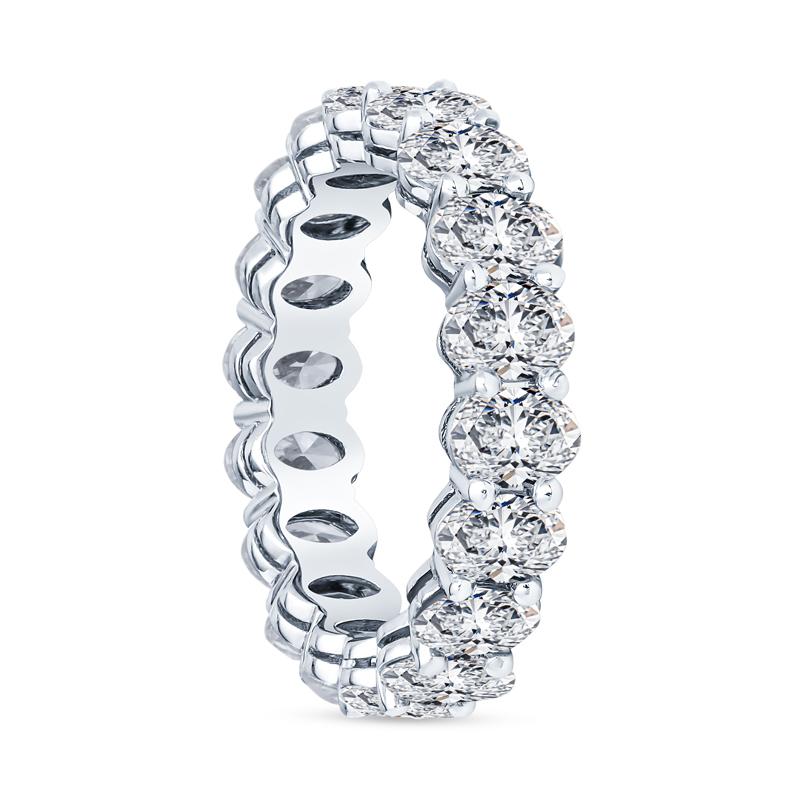 This diamond eternity band features 3.35 carat total weight in eighteen oval diamonds basket set in platinum. Wear alone or layer with your engagement ring or other favorite bands. This ring is a size 4.5. Please contact us regarding sizing.